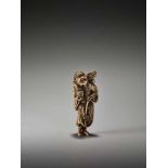 A POWERFUL TALL IVORY NETSUKE OF CHINNAN SENNIN WITH DRAGON AND TAMING STICKUnsigned, ivory