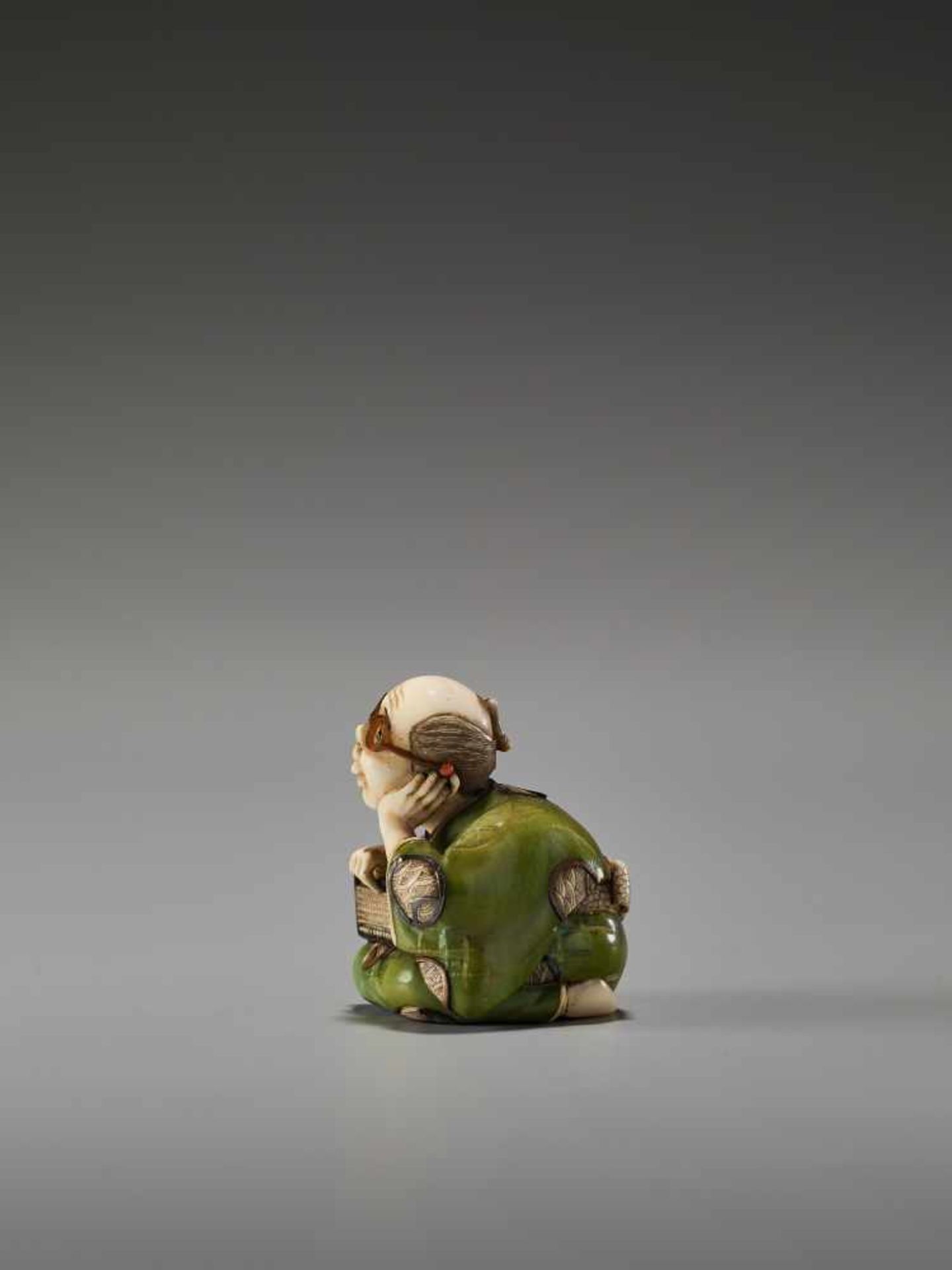 A FINE TOKYO-SCHOOL IVORY NETSUKE OF A MAN WITH GLASSES AND AN ABACUS BY YASUMASABy Yasumasa ( - Image 3 of 9