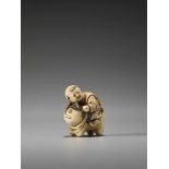 A CHARMING IVORY NETSUKE OF A BOY RIDING A CATUnsigned, ivory netsukeJapan, late 19th century, Meiji