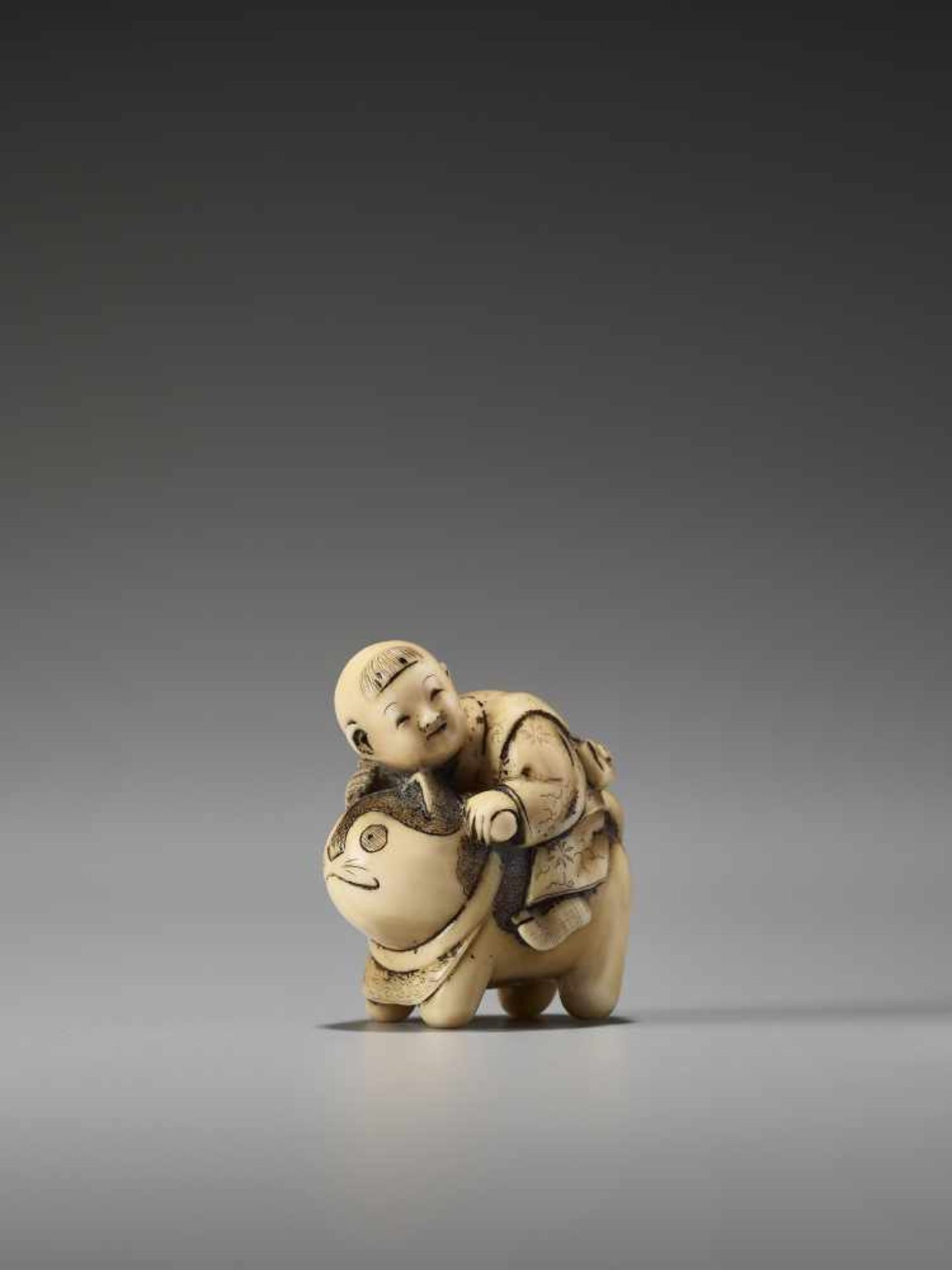 A CHARMING IVORY NETSUKE OF A BOY RIDING A CATUnsigned, ivory netsukeJapan, late 19th century, Meiji