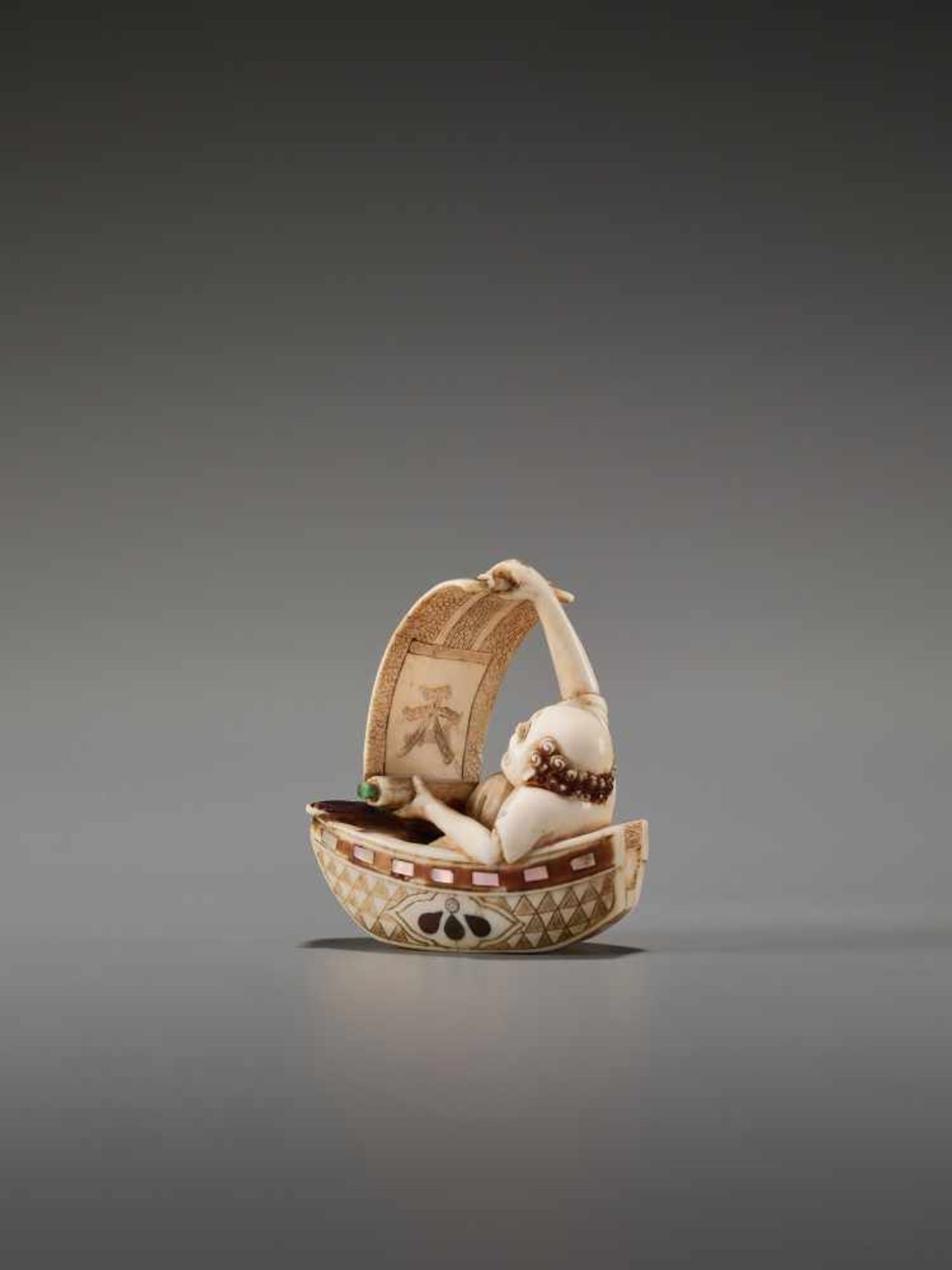 A TOKYO-SCHOOL IVORY NETSUKE OF A FISHERMAN IN A BOAT BY KUSANBy Kusan, ivory netsuke with - Image 2 of 8