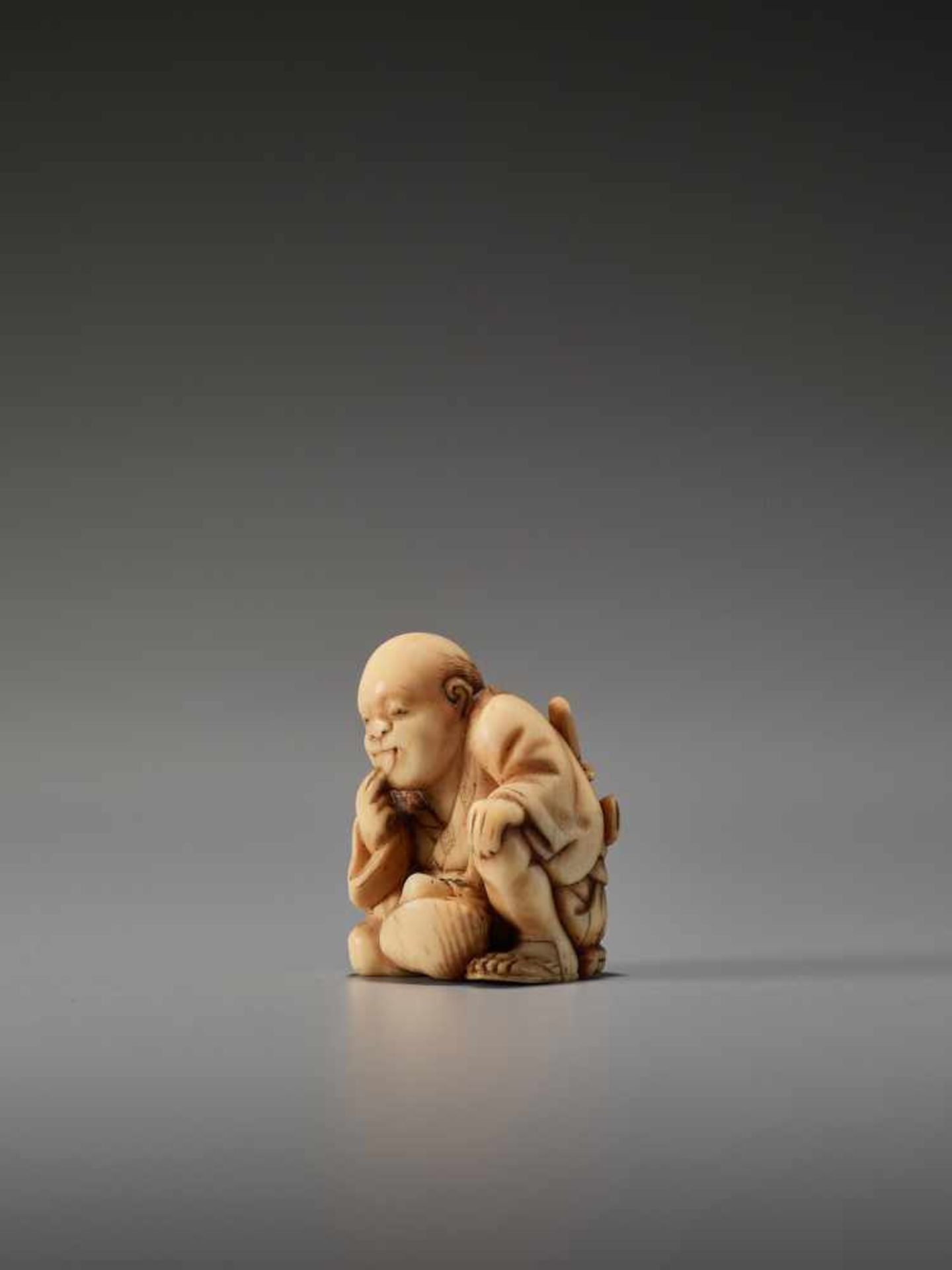 AN IVORY SHUNGA NETSUKE OF A MAN TASTING A CLAM BY THE TOMOCHIKA SCHOOLBy Tomochika, ivory shunga - Image 2 of 8