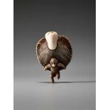 AN AMUSING IVORY NETSUKE OF A SMALL MONKEY CARRYING A LARGE MUSHROOMUnsigned, ivory netsukeJapan,