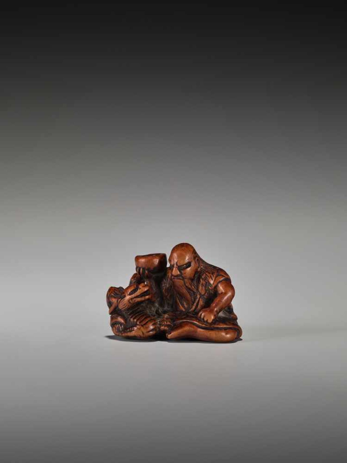 A RARE WOOD NETSUKE OF CHINNAN SENNINUnsigned, wood netsukeJapan, 19th century, Edo period (1615-