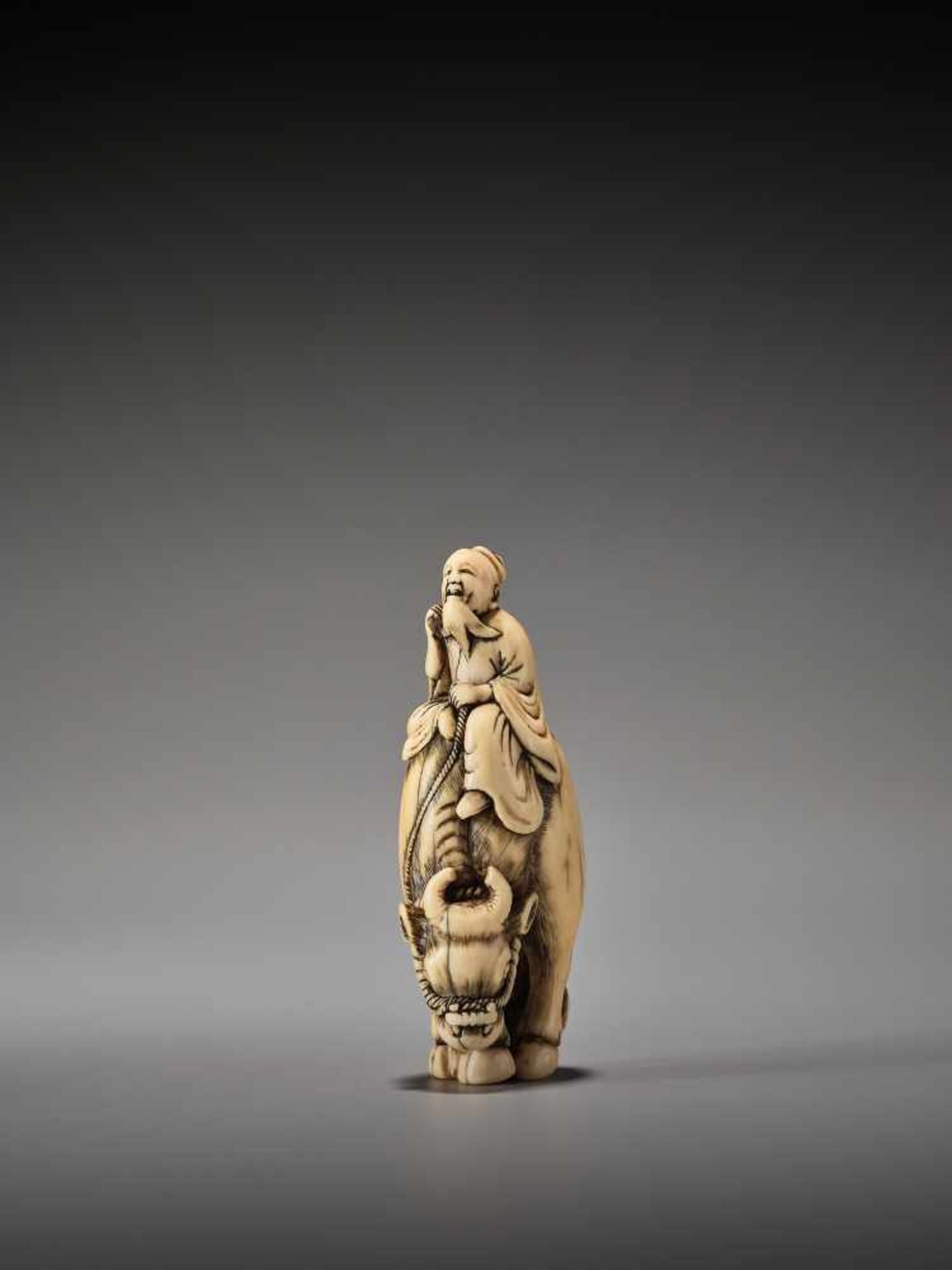 AN IVORY NETSUKE OF ROSHI ON WATER BUFFALOUnsigned, ivory netsukeJapan, 18th century, Edo period ( - Image 2 of 8