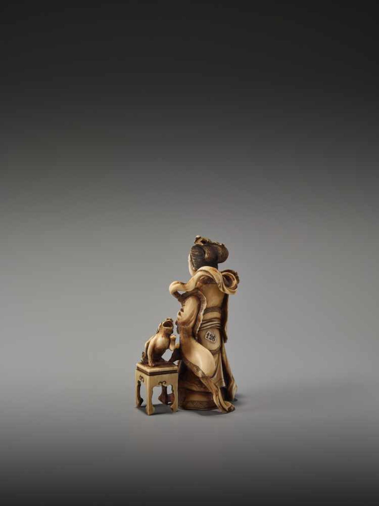 A FINE NETSUKE OKIMONO OF A CHINESE IMMORTAL WITH MYTHICAL DOG BY TEIMINBy Teimin, ivory okimono- - Image 4 of 9