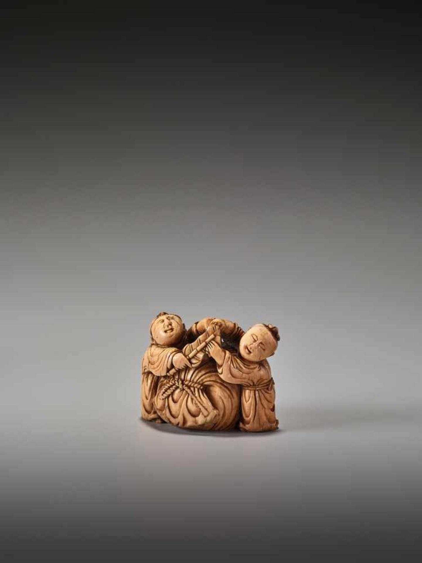 A VERY RARE 17TH CENTURY IVORY NETSUKE OF TWO CHINESE BOYS WITH HOTEI’S SACKUnsigned, ivory - Image 2 of 6