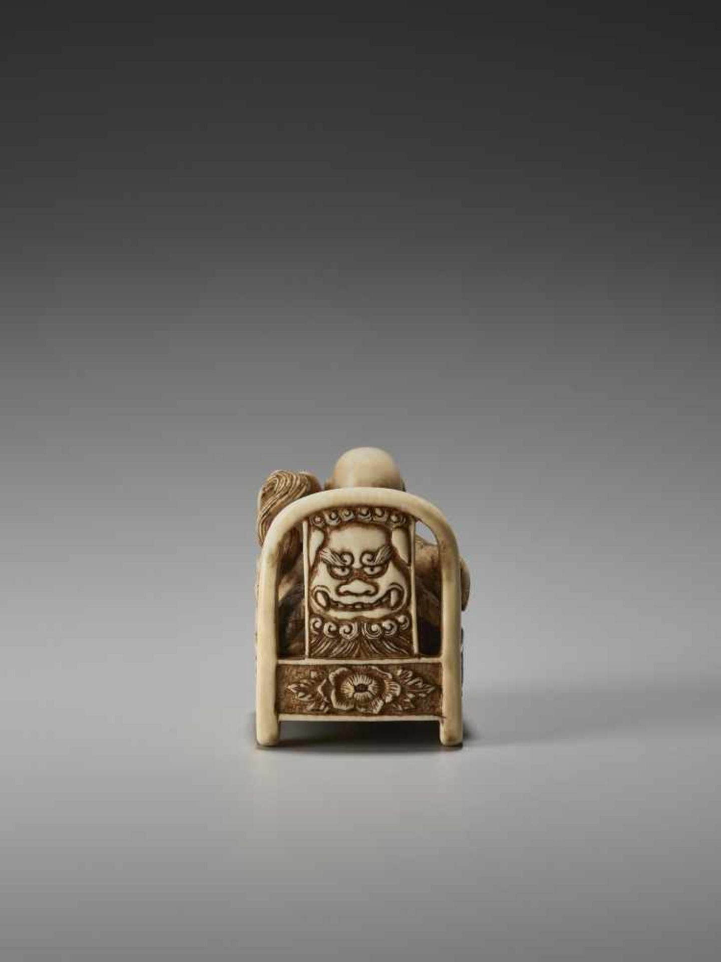 AN UNUSUAL IVORY NETSUKE OF HOTEI ON A THRONE BY CHIKUSAIBy Chikusai, ivory netsukeJapan, mid-19th - Image 2 of 9