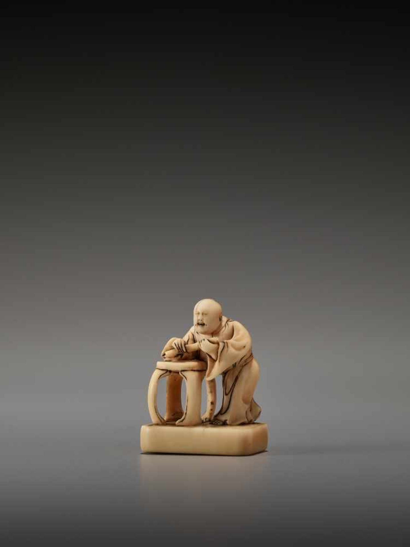 AN EARLY IVORY NETSUKE OF A CHINESE IMMORTAL WITH A FLUTEUnsigned, ivory netsukeJapan, 18th century,