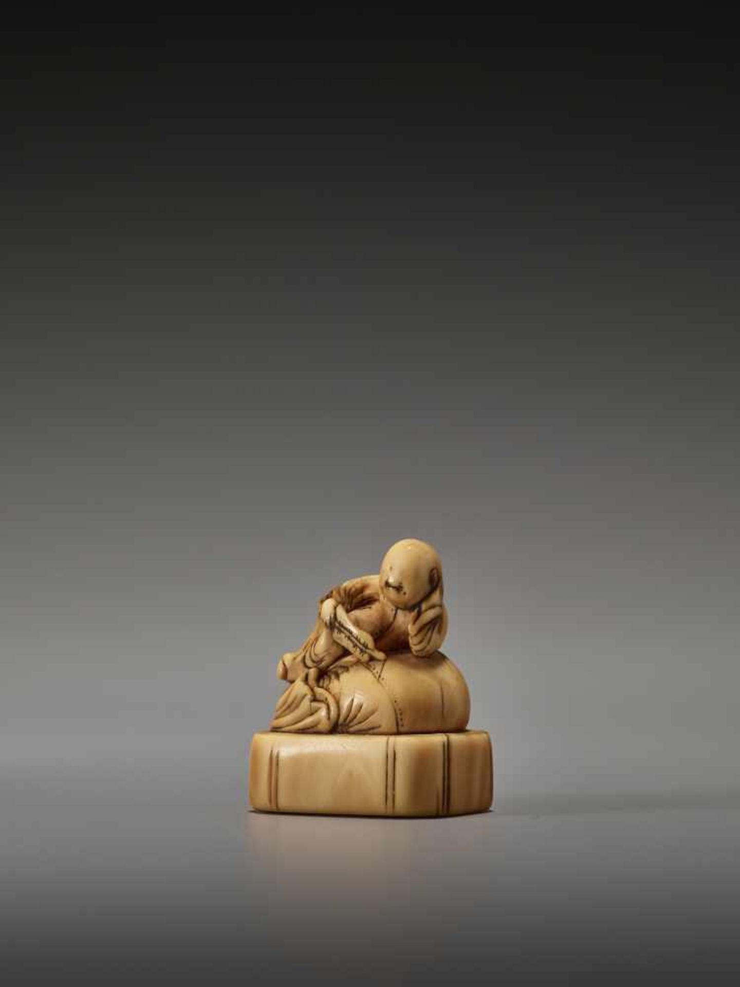 AN EARLY IVORY NETSUKE OF A CHINESE BOY ON HOTEI’S SACKUnsigned, ivory netsukeJapan, 18th century, - Image 2 of 6