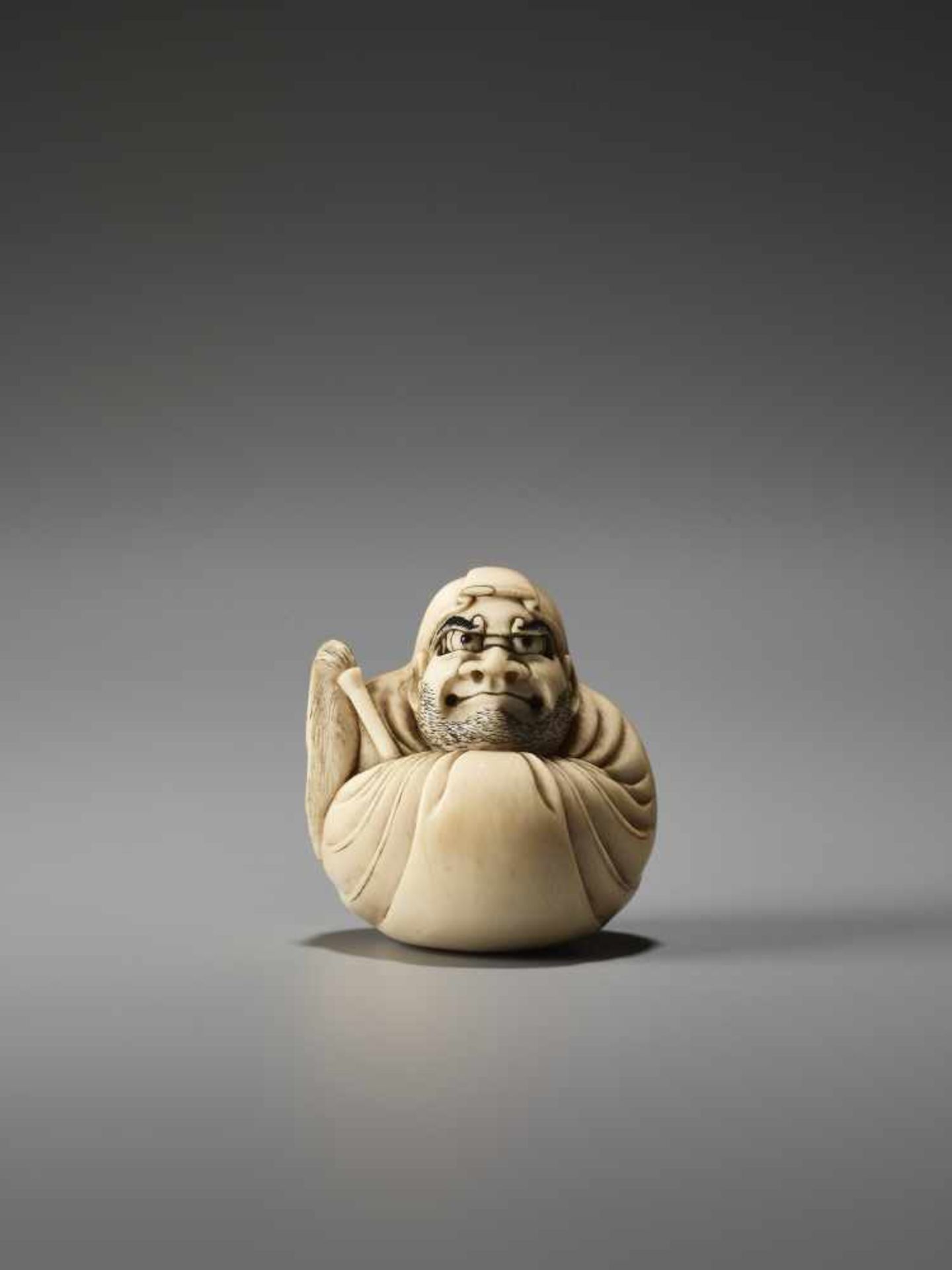 AN IVORY NETSUKE OF DARUMA WALL-GAZING BY MASAHIROBy Masahiro, ivory netsukeJapan, Osaka, mid-19th