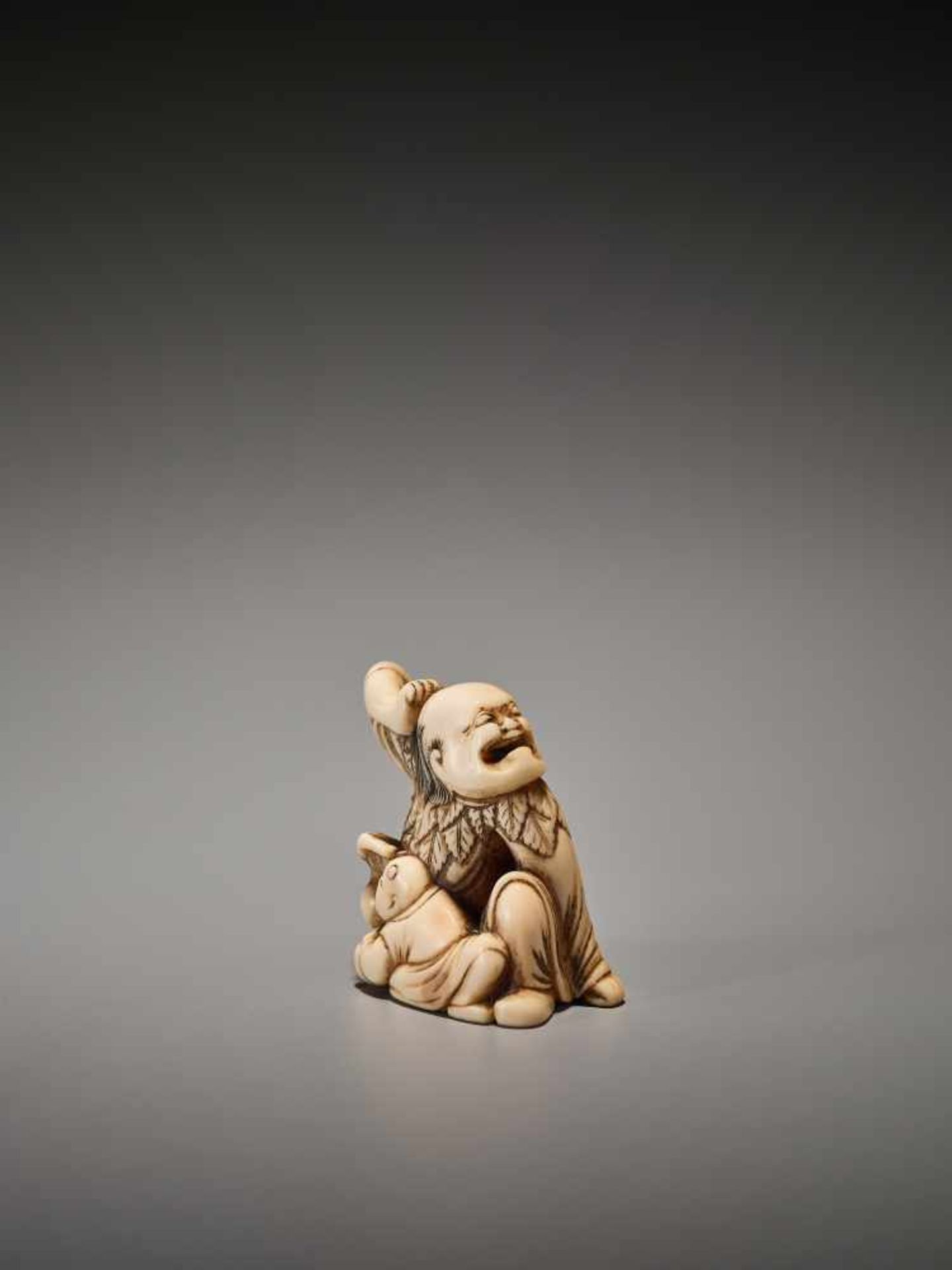 A POWERFUL IVORY NETSUKE OF A SENNIN WITH BOY AND PEACH Unsigned, ivory netsukeJapan, Kyoto, 18th - Image 3 of 6