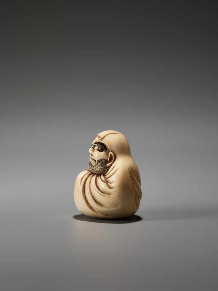 AN IVORY NETSUKE OF DARUMA WALL-GAZING BY MASAHIROBy Masahiro, ivory netsukeJapan, Osaka, mid-19th - Image 3 of 7