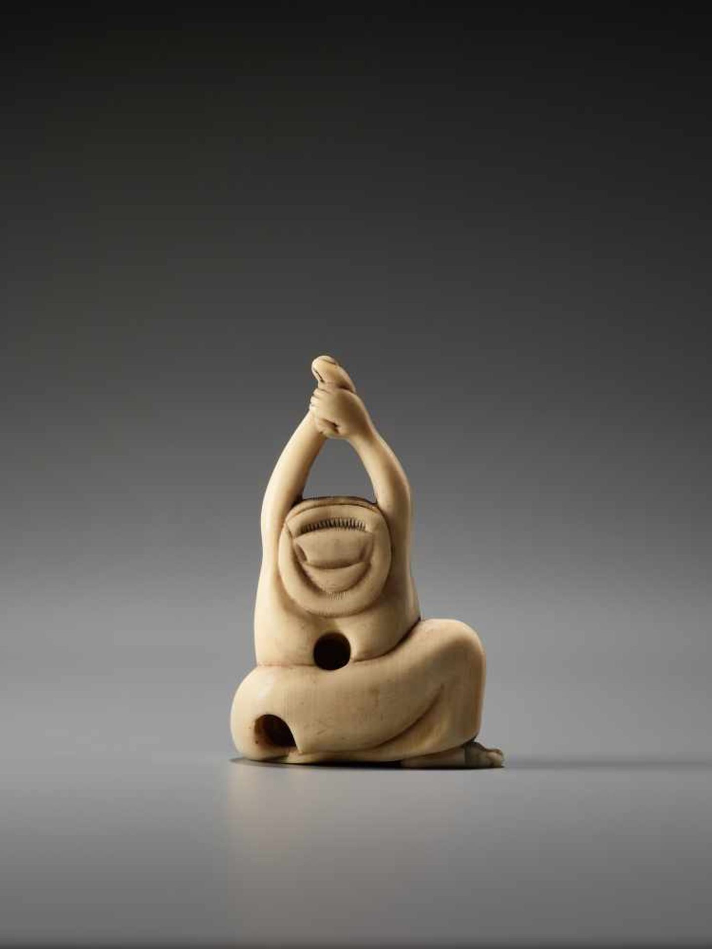 AN IVORY NETSUKE OF OKAME YAWNINGUnsigned, ivory netsukeJapan, early 19th century, Edo period ( - Image 4 of 6