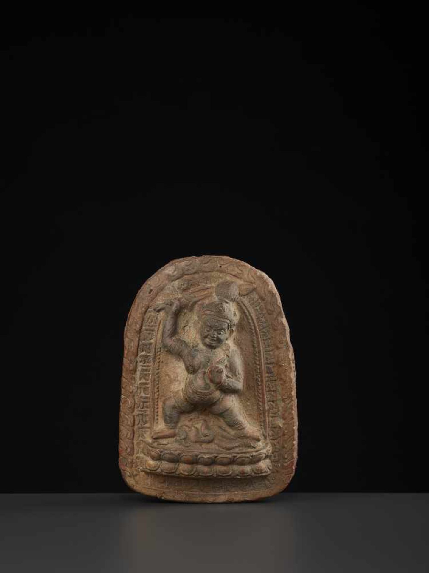 A LARGE TSA-TSA OF MAHAKALATibet 18th -19th century. Neatly molded of clay with cold painted