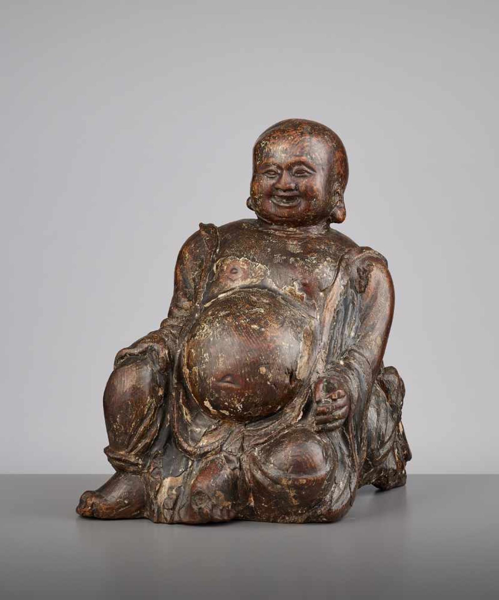 AN EXPRESSIVE WOOD BUDAI, MINGChina, 15th - 16th century. This earthy yet radiant sculpture of Budai - Image 2 of 9