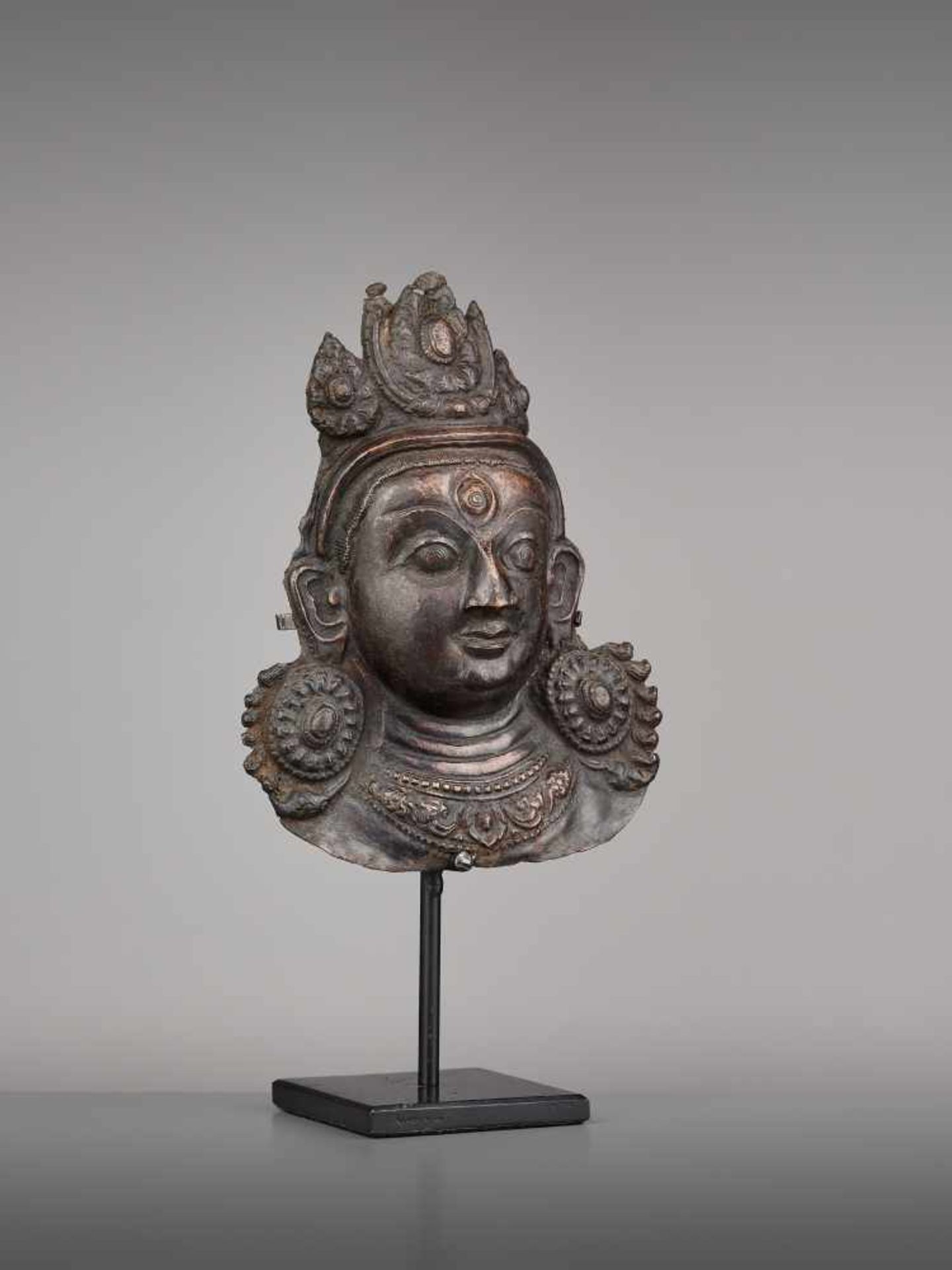 A COPPER REPOUSSE MASK OF BHAIRAVA Nepal, 17th century. The expressive copper mask with well- - Image 4 of 6