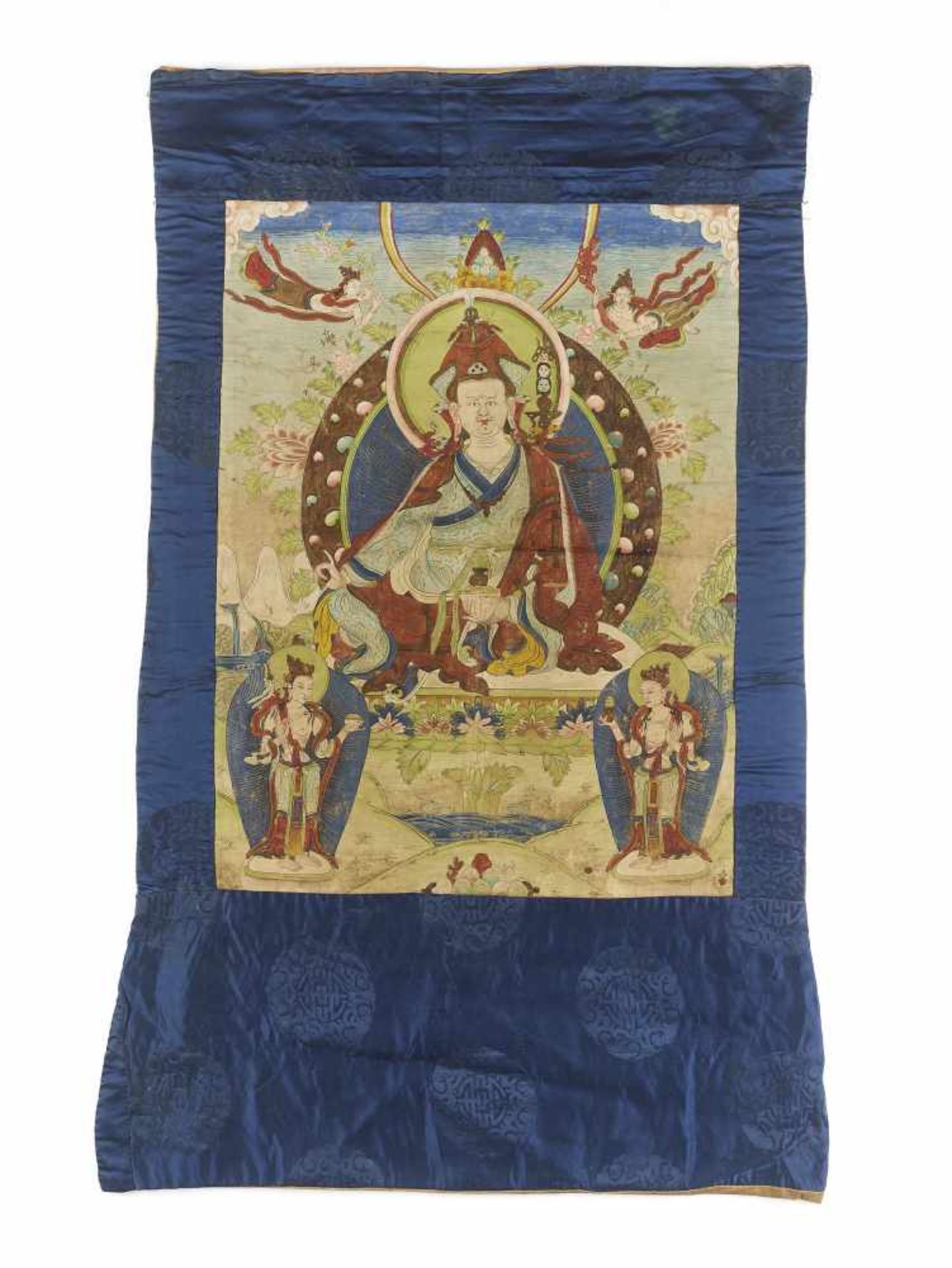 A PADMASAMBHAVA THANGKA EARLY 1800sTibet, circa 1800. Seated on a throne, his hands in varada- and - Image 2 of 6
