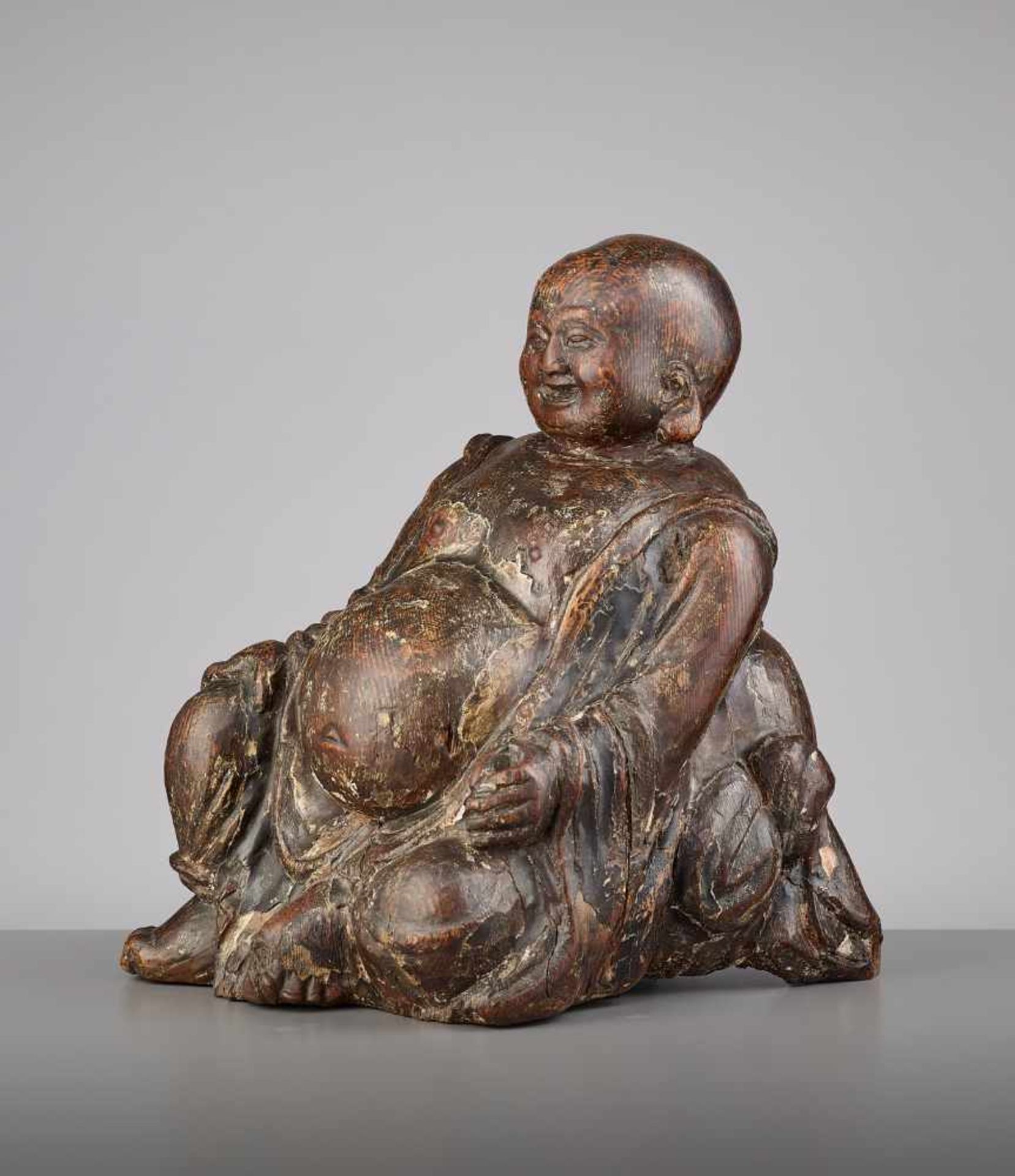 AN EXPRESSIVE WOOD BUDAI, MINGChina, 15th - 16th century. This earthy yet radiant sculpture of Budai - Image 4 of 9