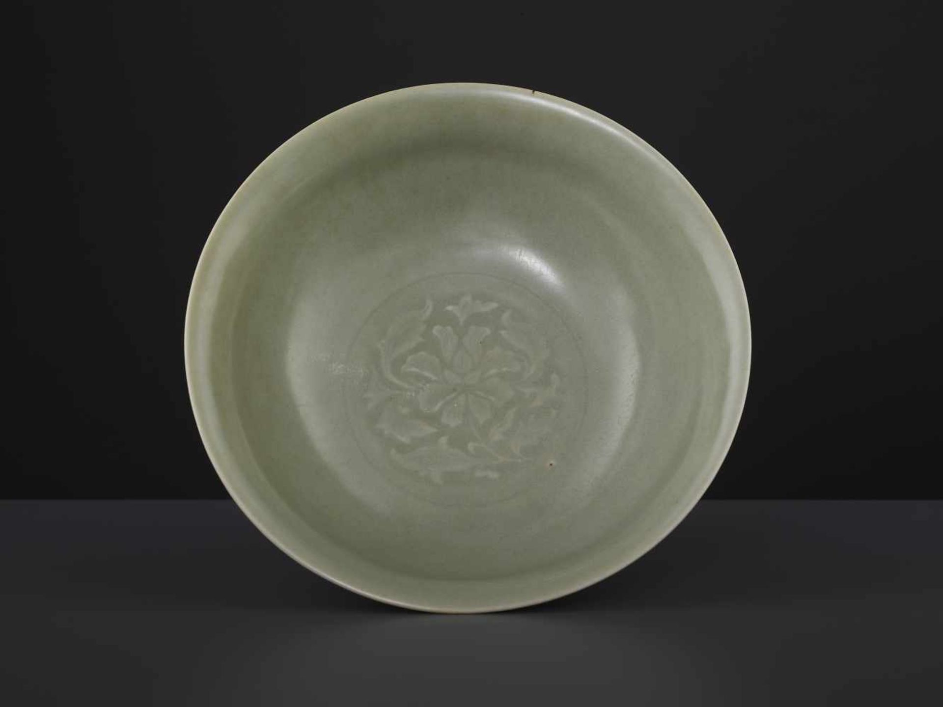 A CARVED LONQUAN LOTUS BOWL, MINGChina, 16th/17th century. Covered overall (except the foot rim) - Image 3 of 6