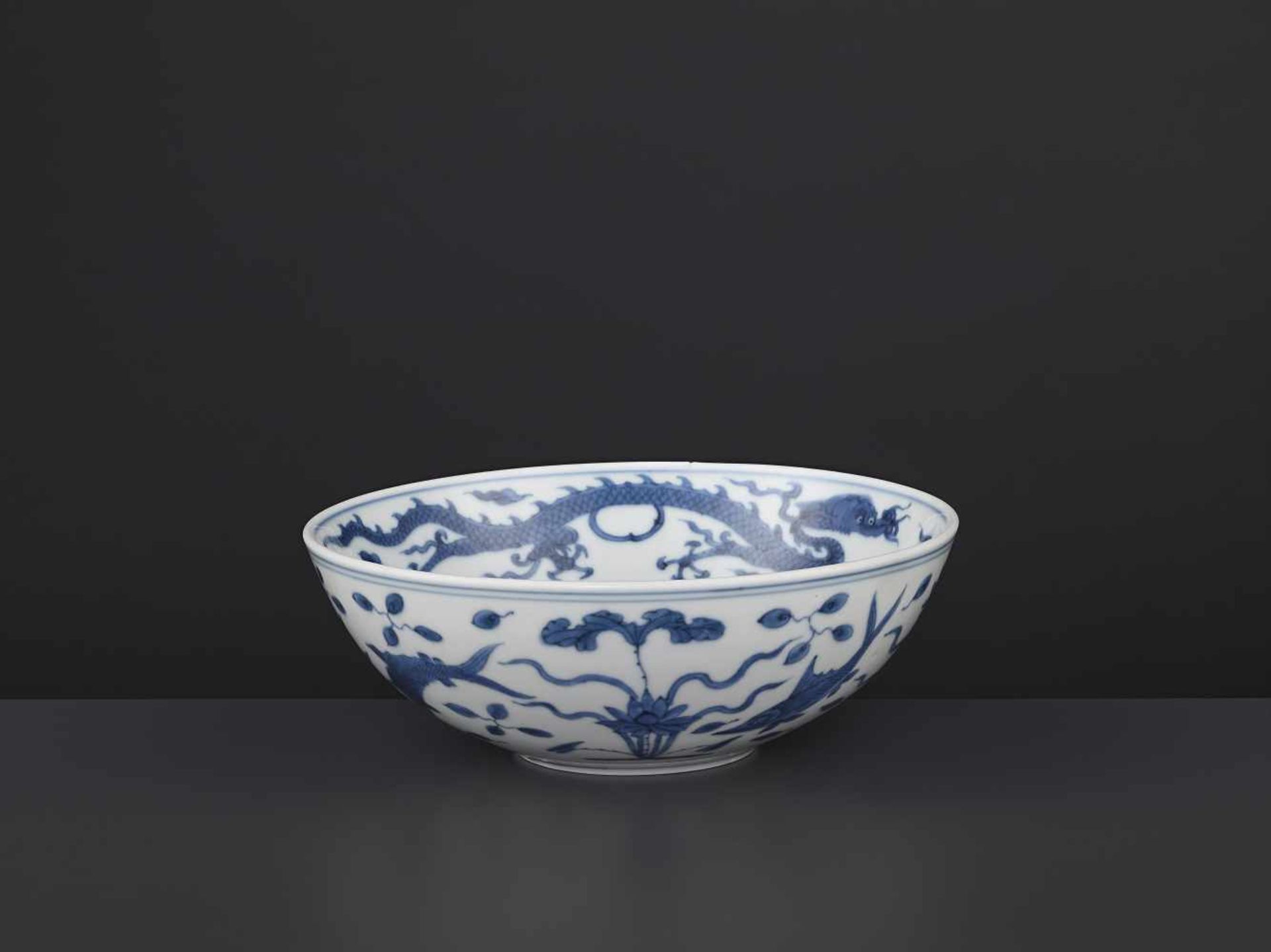 A JIAJING MARK & PERIOD ‘REBUS’ BOWL China, 1522-1566. Freely painted in shaded tones of cobalt with