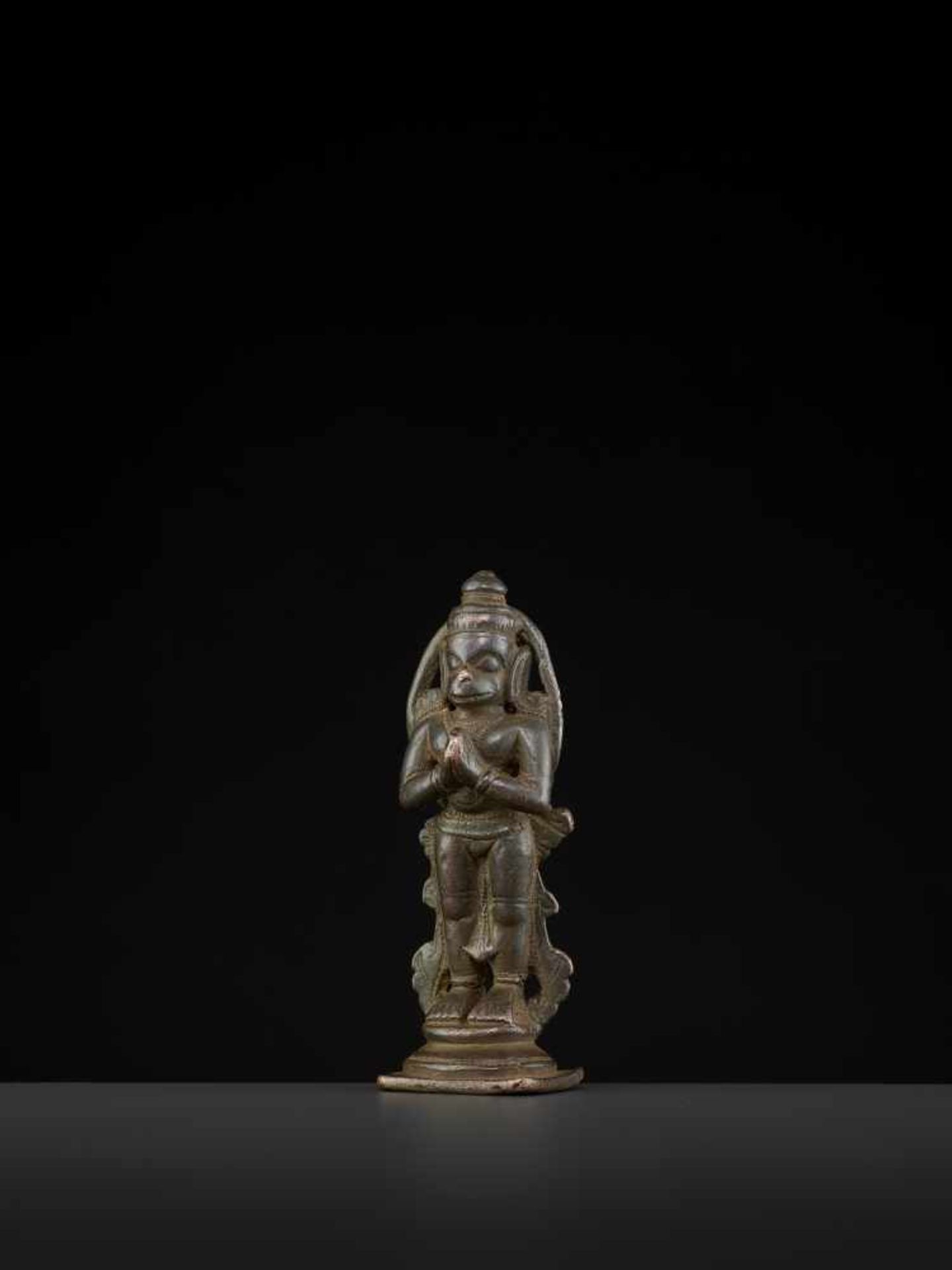 A HANUMAN BRONZE 17TH CENTURYIndia, 17th-18th century. This miniature bronze depicts Hanuman in a - Image 2 of 7