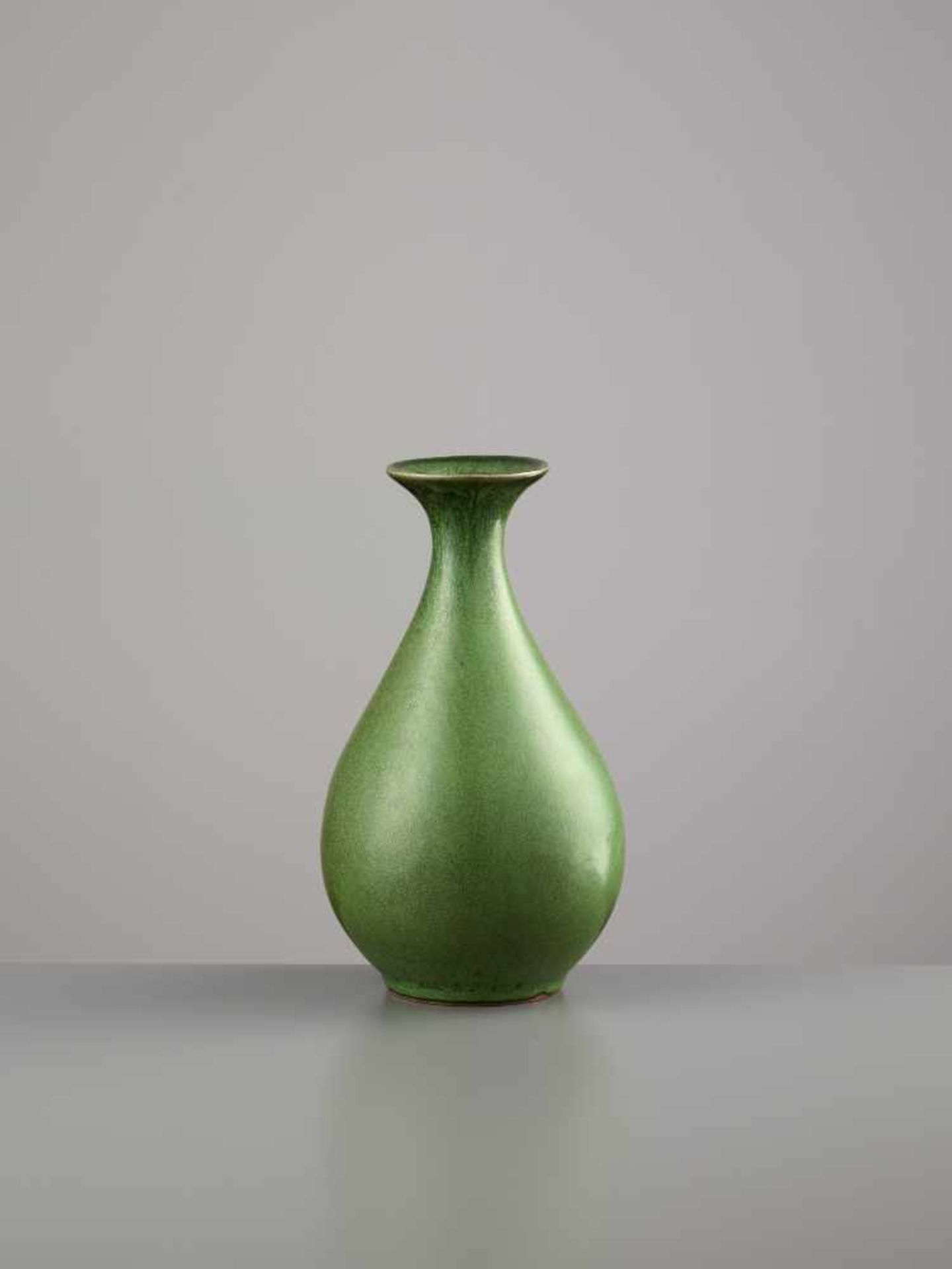 A YUHUCHUN PING, 18TH CENTURYChina, 1700-1800. The pear-shaped vase is covered by an elegant,