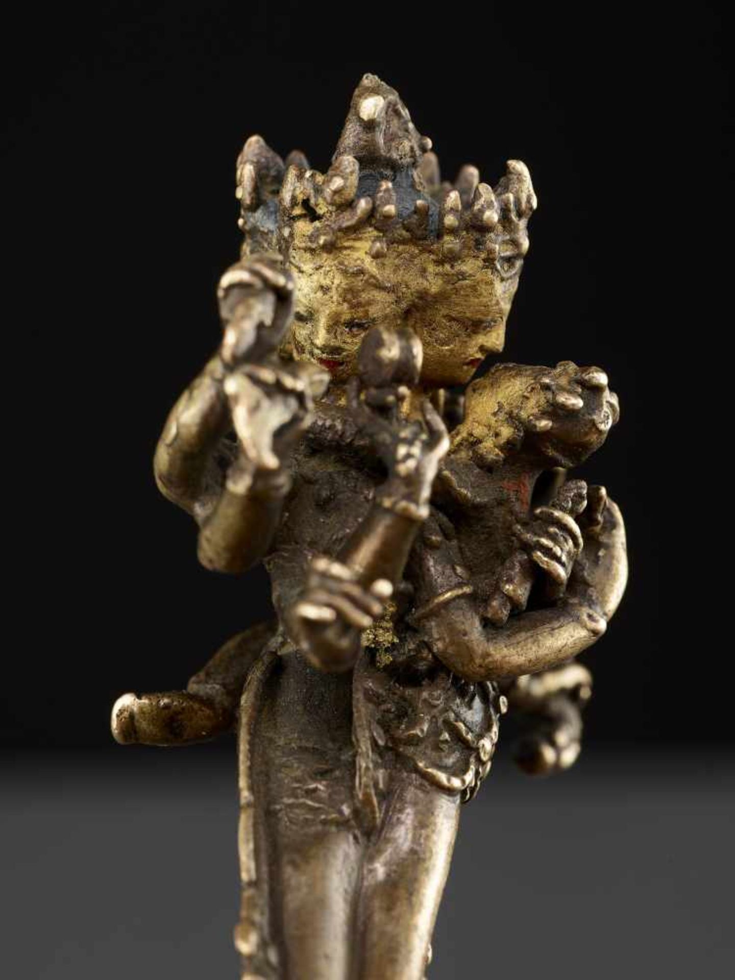 A CAKRASAMVARA BRONZE 17TH CENTURY Nepal. The four-headed and twelve-armed Cakrasamvara entangled by - Image 4 of 15