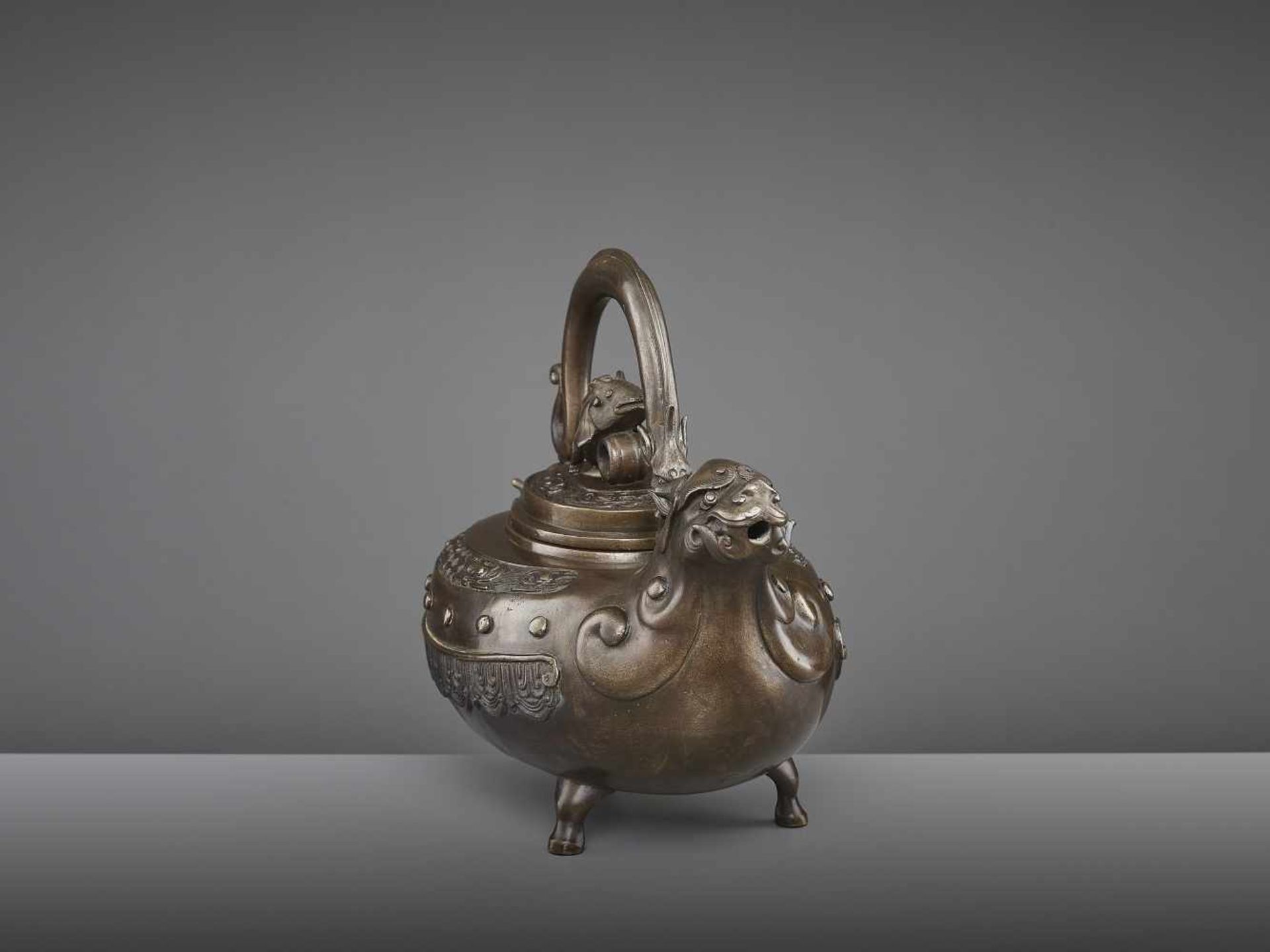 A BRONZE DRAGON EWER, QING China, 18th - 19th century. The lidded tripod vessel with a dragon head - Image 6 of 9