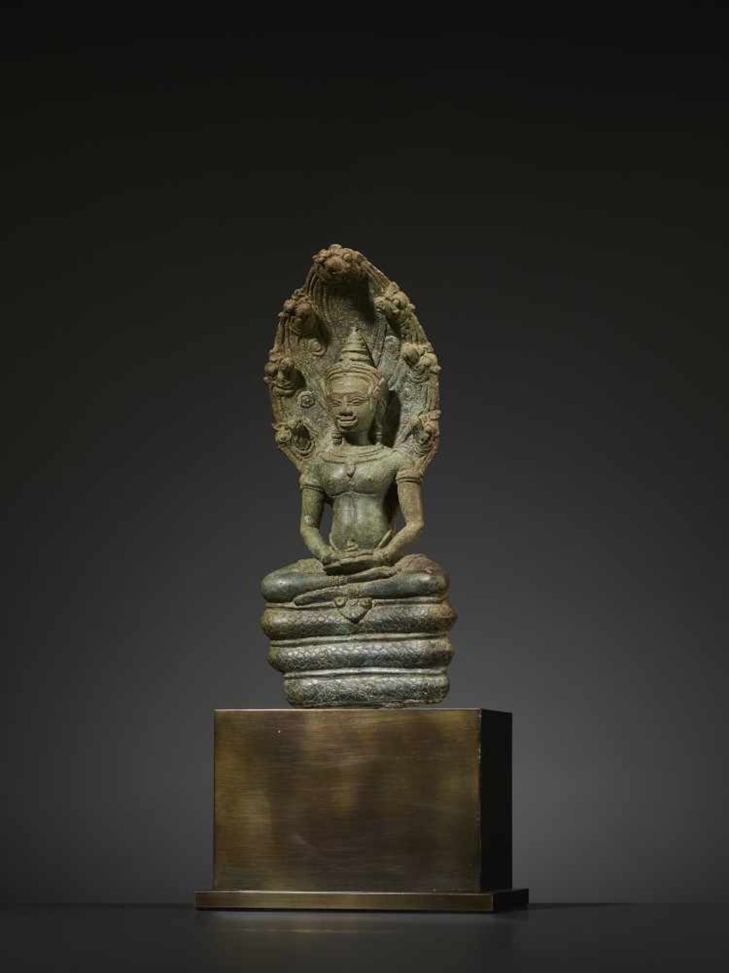 A KHMER BRONZE BUDDHA MUCHALINDA Cambodia, Angkor period, 12th century. Finely cast and incised - Image 2 of 8