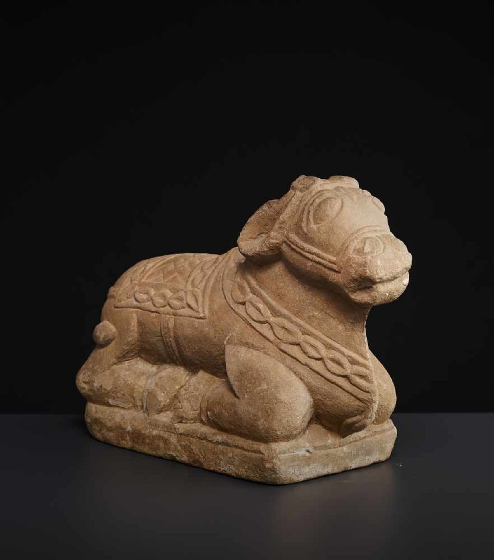 A SANDSTONE NANDI 15TH CENTURYIndia, Uttar Pradesh, 15th-16th century. The divine bull and companion