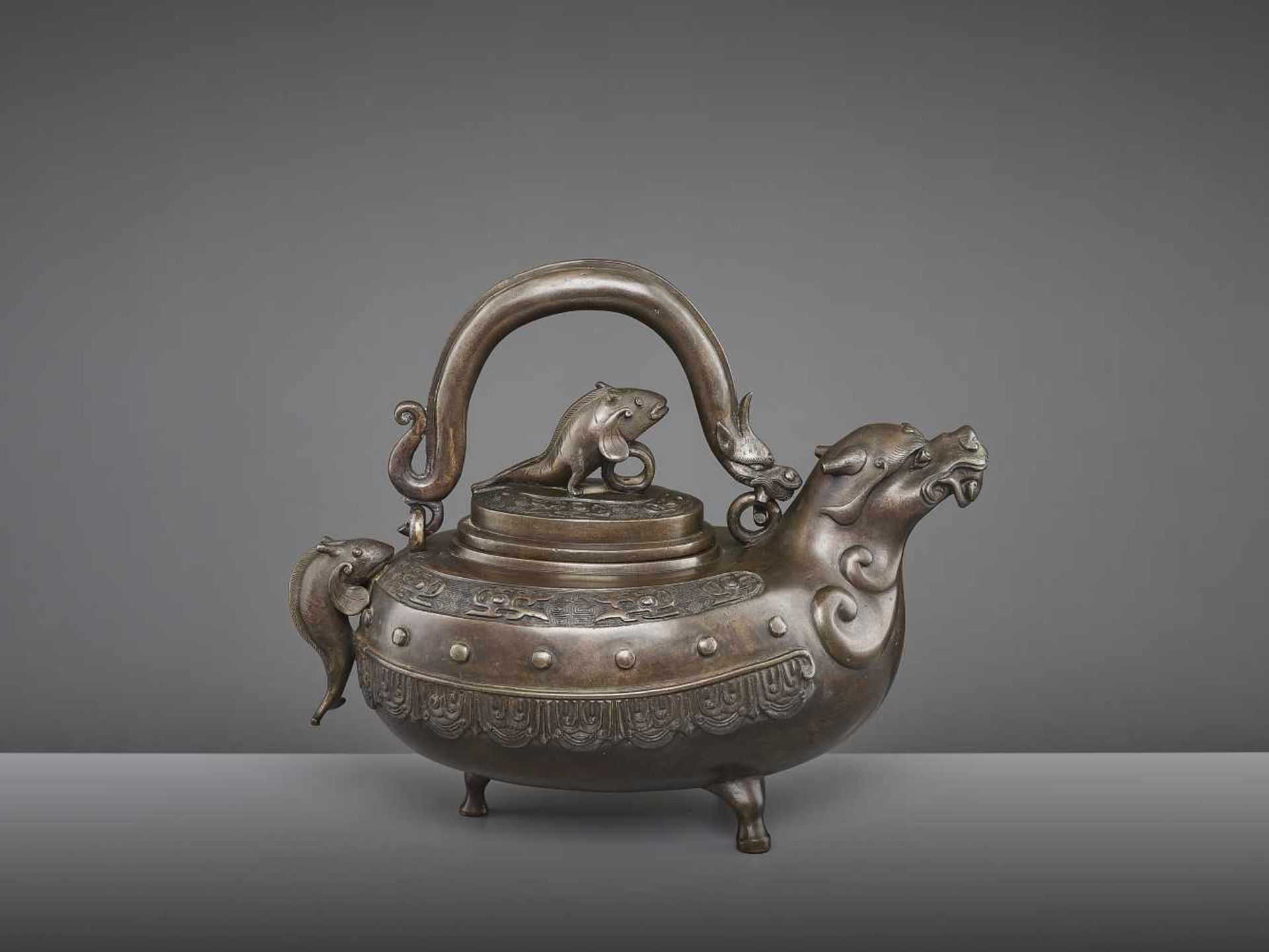 A BRONZE DRAGON EWER, QING China, 18th - 19th century. The lidded tripod vessel with a dragon head - Image 4 of 9