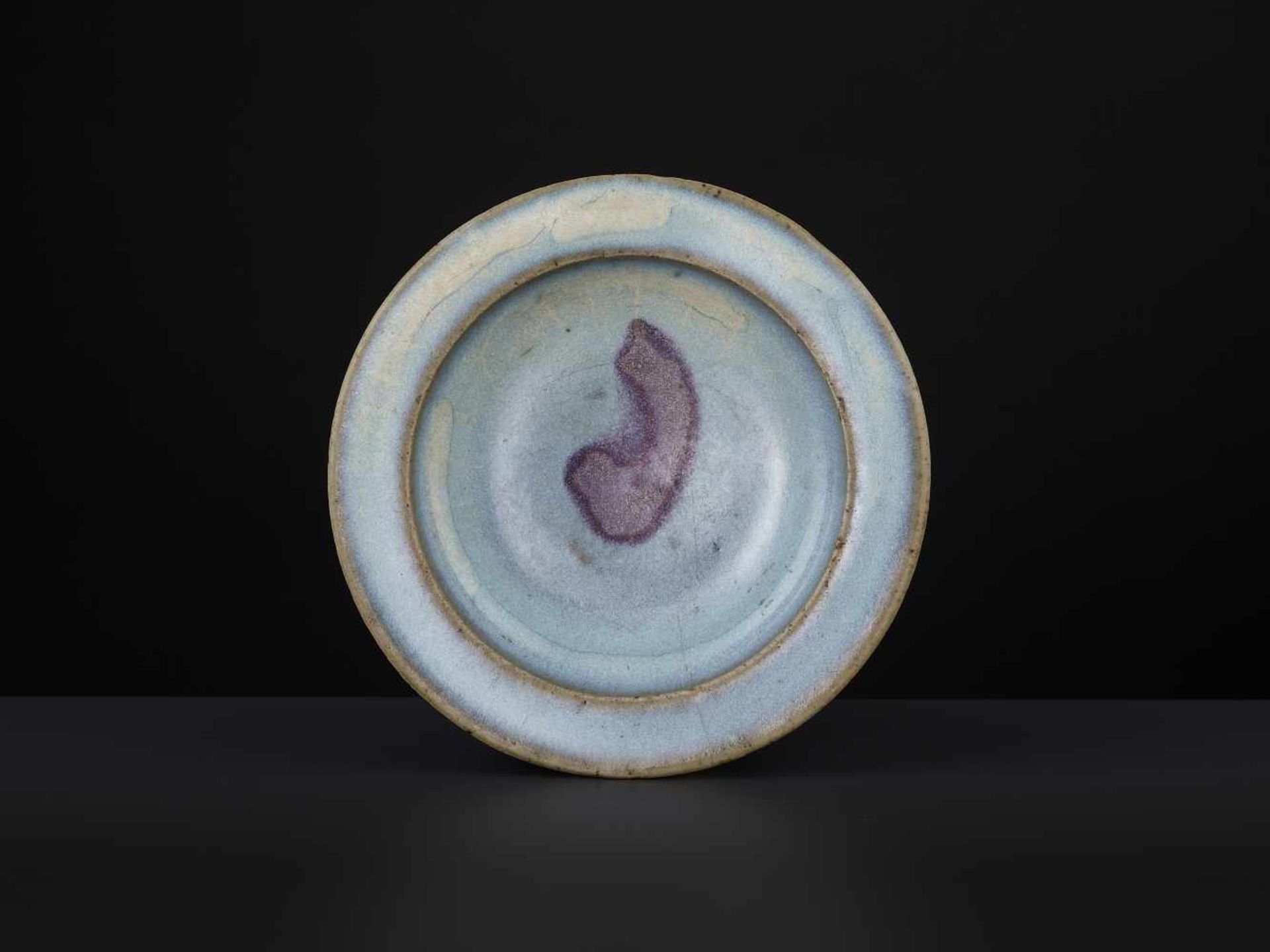 A JUNYAO DISH, SONG DYNASTYChina, 12th-13th century. Finely potted with shallow sides and a