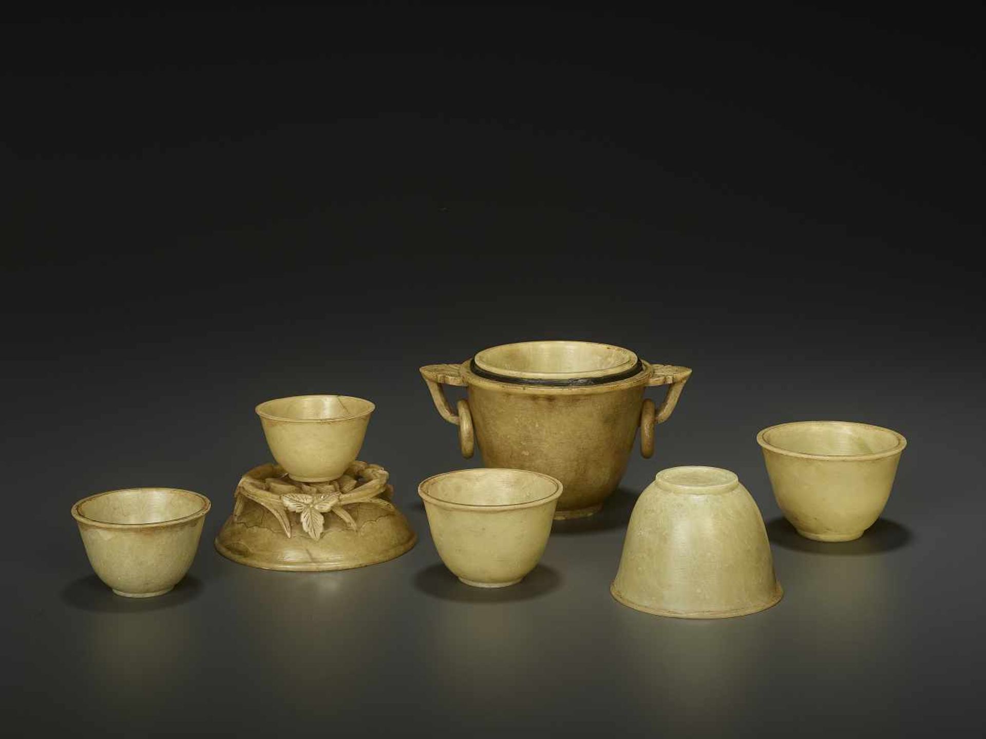 A SET OF SOAPSTONE CUPS, QINGChina, late 18th - mid-19th century. The main vessel contains five more