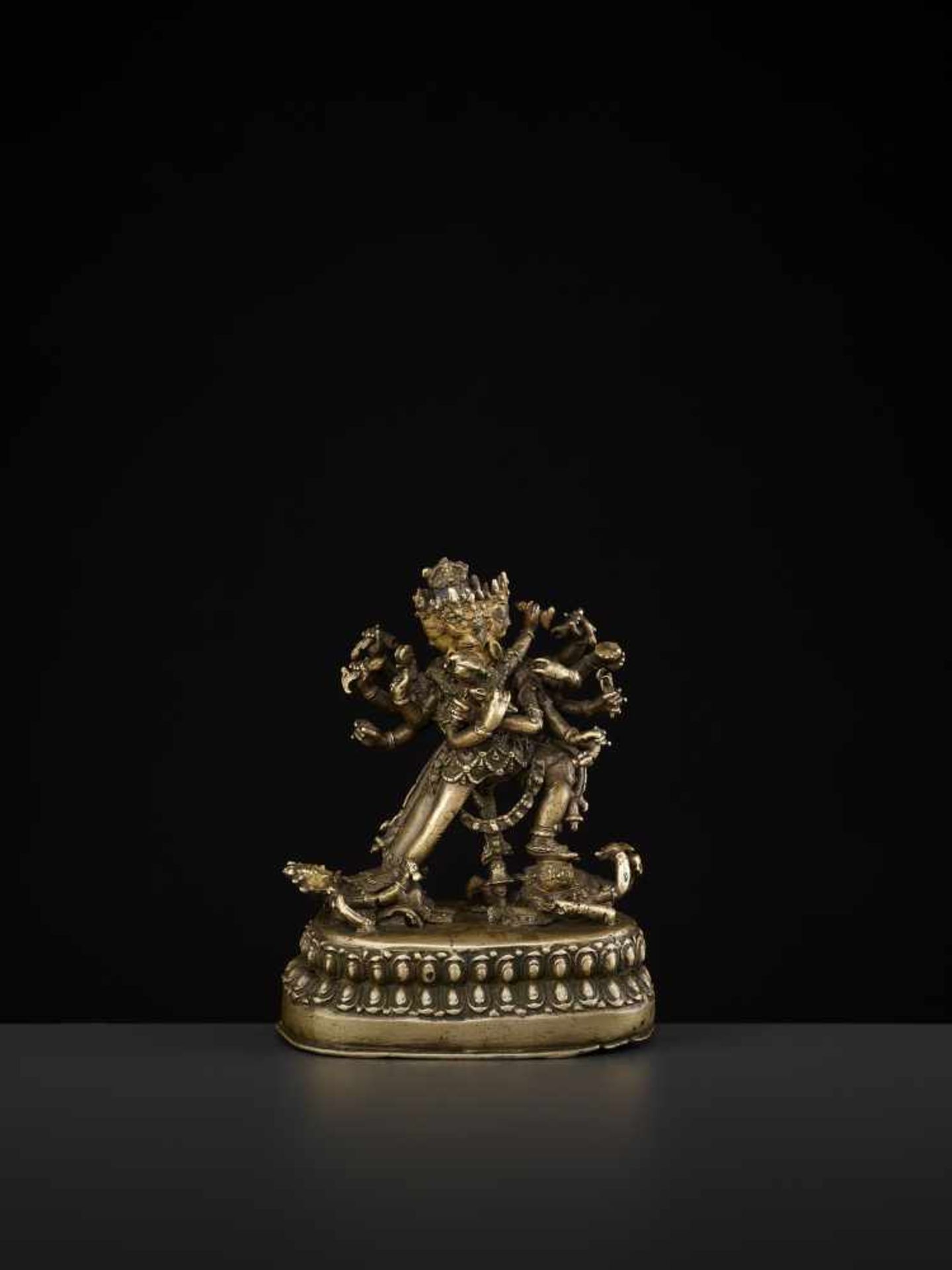 A CAKRASAMVARA BRONZE 17TH CENTURY Nepal. The four-headed and twelve-armed Cakrasamvara entangled by