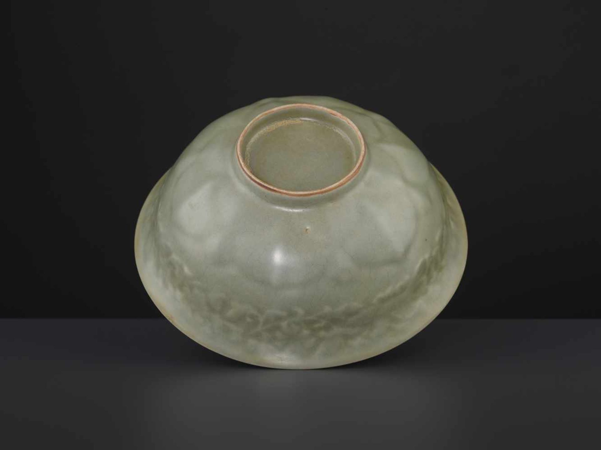 A CARVED LONQUAN LOTUS BOWL, MINGChina, 16th/17th century. Covered overall (except the foot rim) - Image 2 of 6