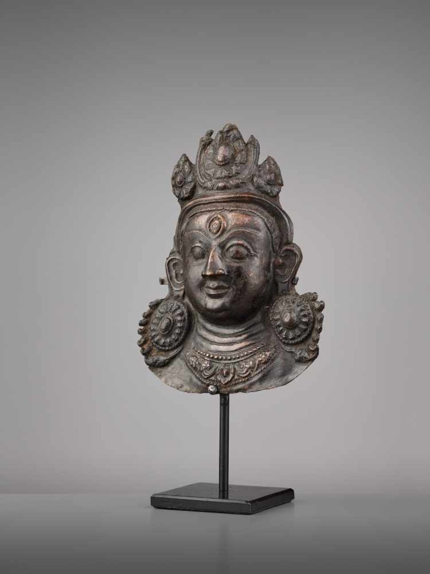 A COPPER REPOUSSE MASK OF BHAIRAVA Nepal, 17th century. The expressive copper mask with well- - Image 2 of 6