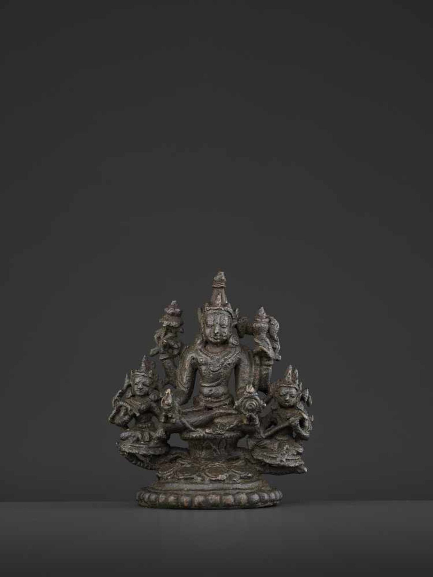 A PALA-SENA BRONZE VISHNU TRIADBangladesh, 11th - 12th century. Neatly cast and incised copper alloy