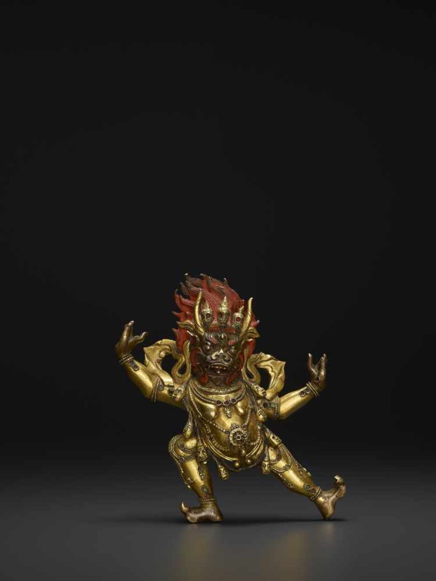 A TIBETAN BRONZE YAMA DHARMARAJA18th century. Fire gilt and incised bronze statue with dramatic cold