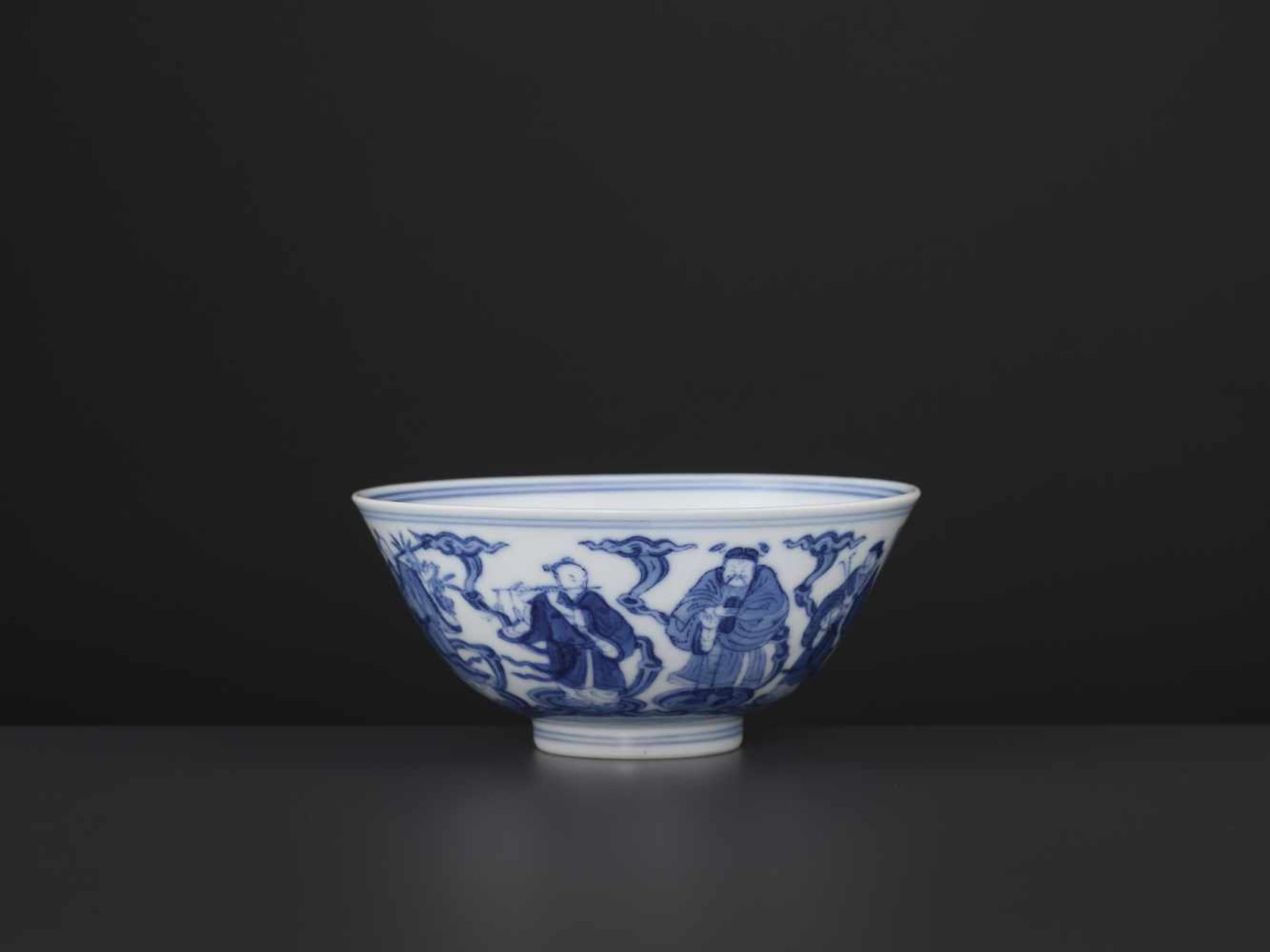 A DAOGUANG MARK AND PERIOD BOWLChina, 1821-1850. Depiction of the Eight Daoist Immortals. The base