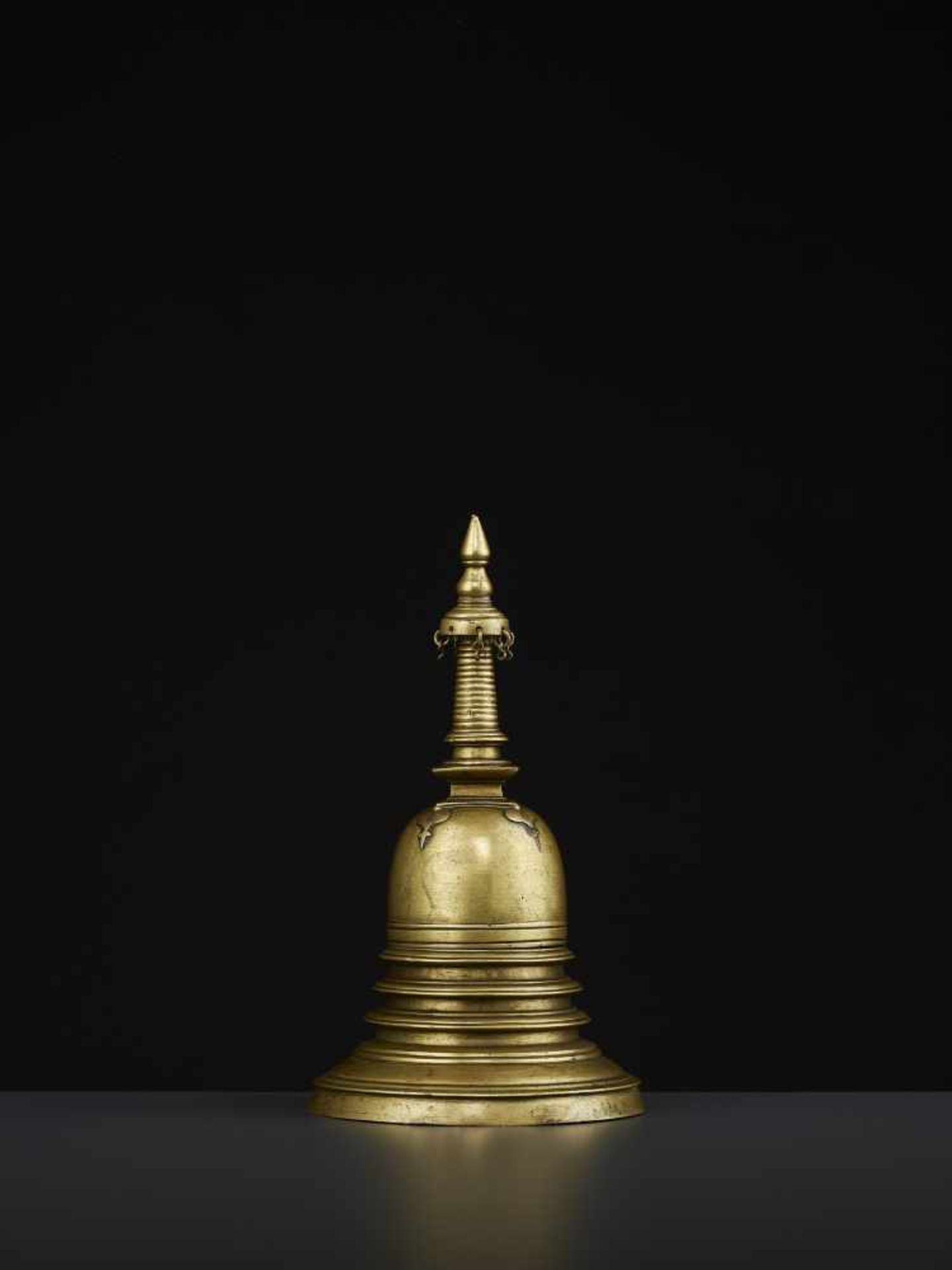 A 19TH CENTURY RELIQUARY STUPA South East Asia, 19th century. The bronze stupa with its originally - Image 5 of 8