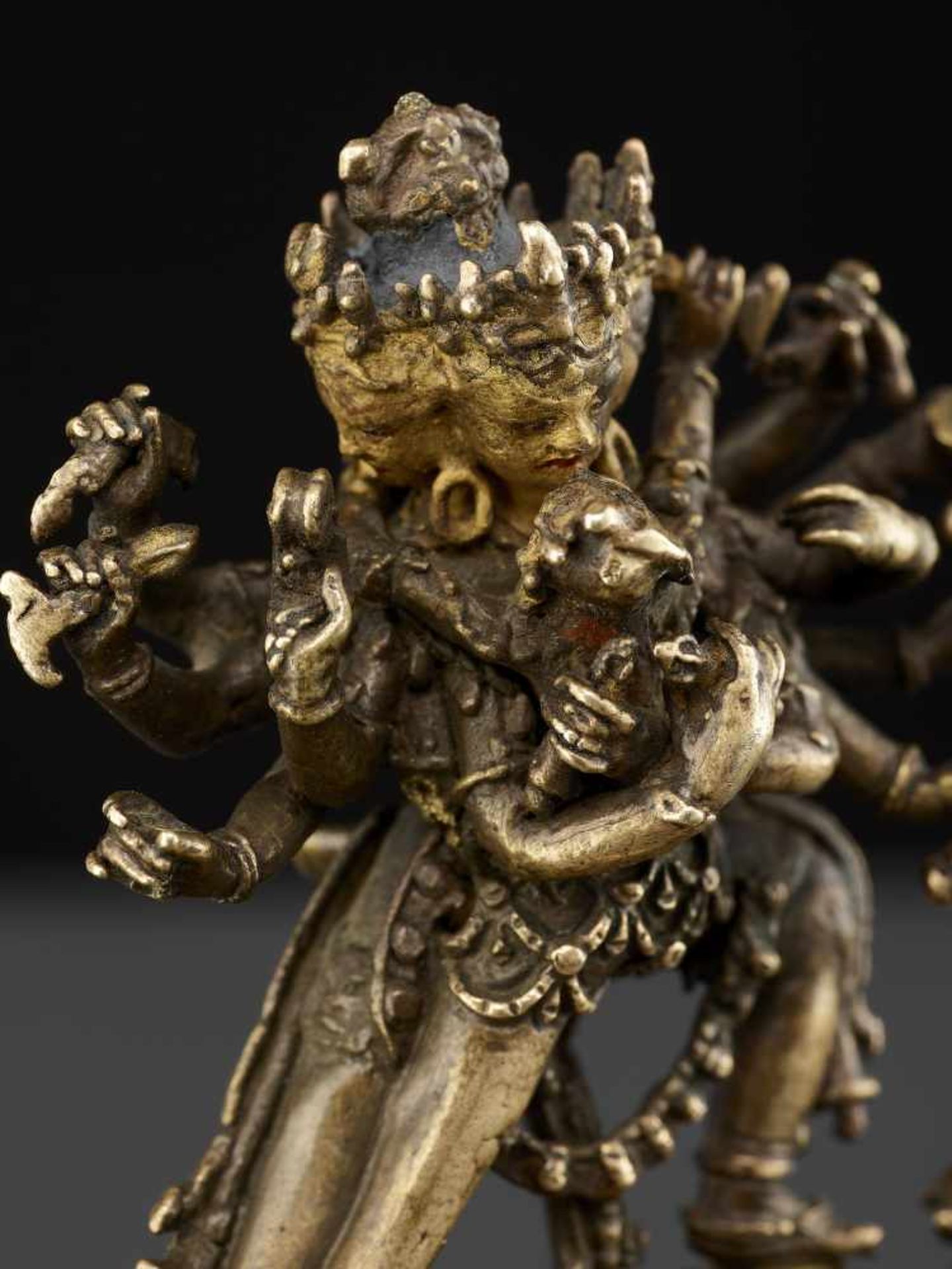 A CAKRASAMVARA BRONZE 17TH CENTURY Nepal. The four-headed and twelve-armed Cakrasamvara entangled by - Image 2 of 15