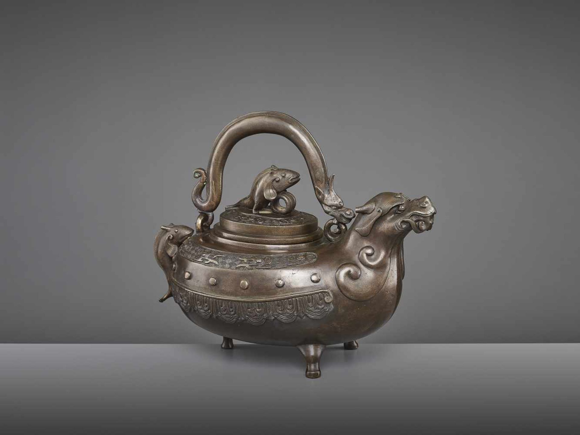 A BRONZE DRAGON EWER, QING China, 18th - 19th century. The lidded tripod vessel with a dragon head - Image 5 of 9