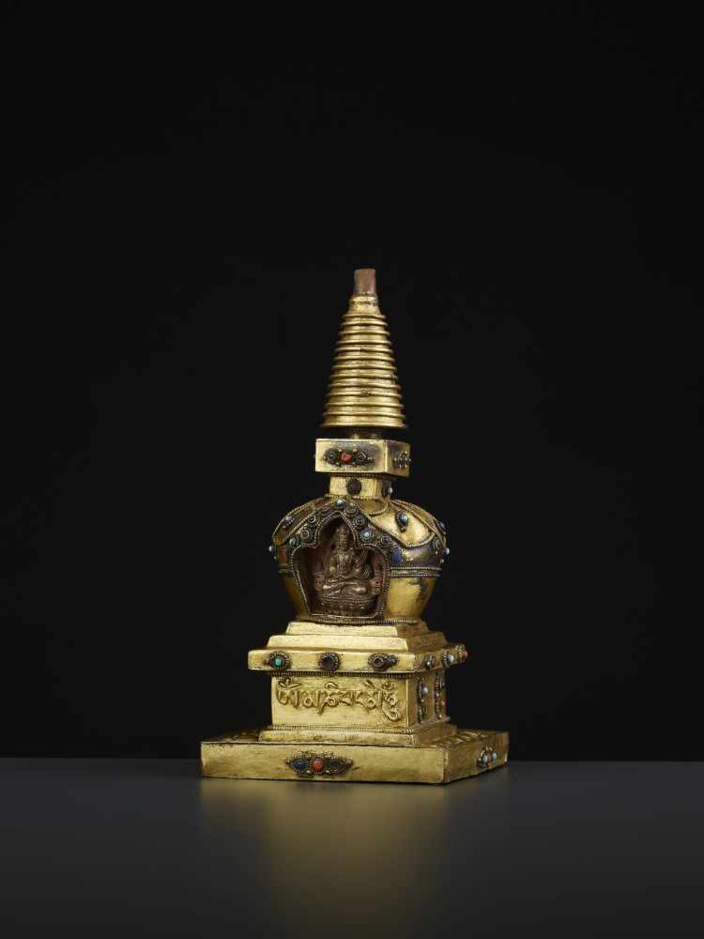 A REPOUSSE STUPA 18TH CENTURYTibet, 18TH to earlier 19TH century. A fire-gilt copper model of a