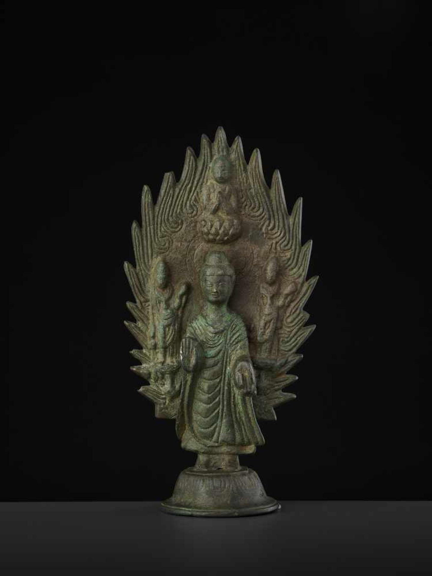 A BRONZE BUDDHA DATED 571 China, Northern Qi dynasty. Cast and incised bronze with a rich,