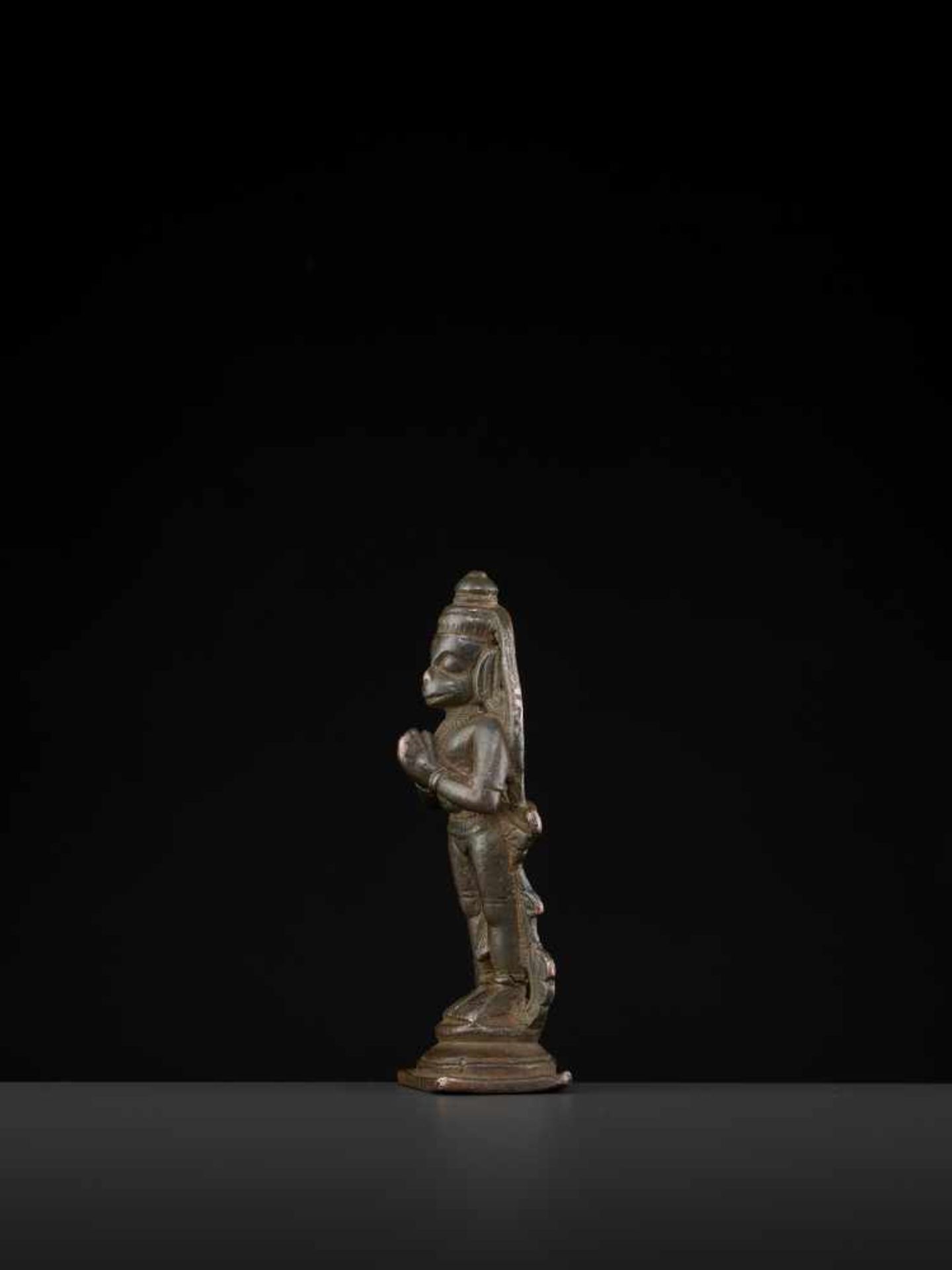 A HANUMAN BRONZE 17TH CENTURYIndia, 17th-18th century. This miniature bronze depicts Hanuman in a - Image 3 of 7