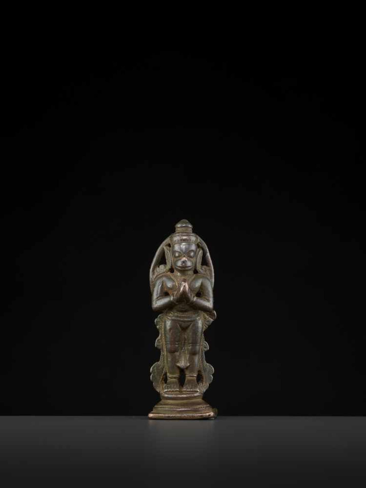 A HANUMAN BRONZE 17TH CENTURYIndia, 17th-18th century. This miniature bronze depicts Hanuman in a