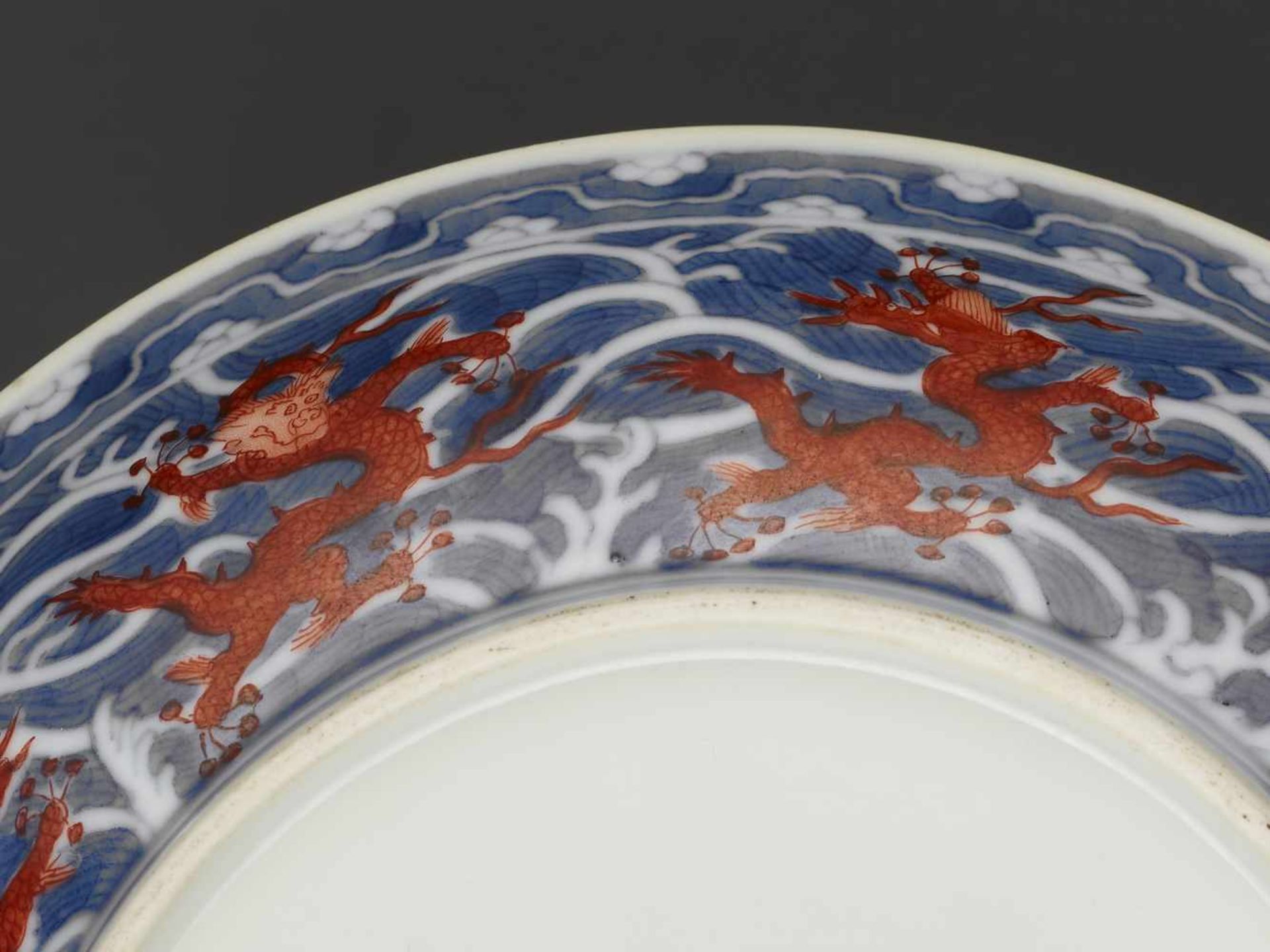 A DAOGUANG MARK & PERIOD DRAGON DISHChina, 1821-1850. Porcelain painted in iron red and underglaze- - Image 5 of 10