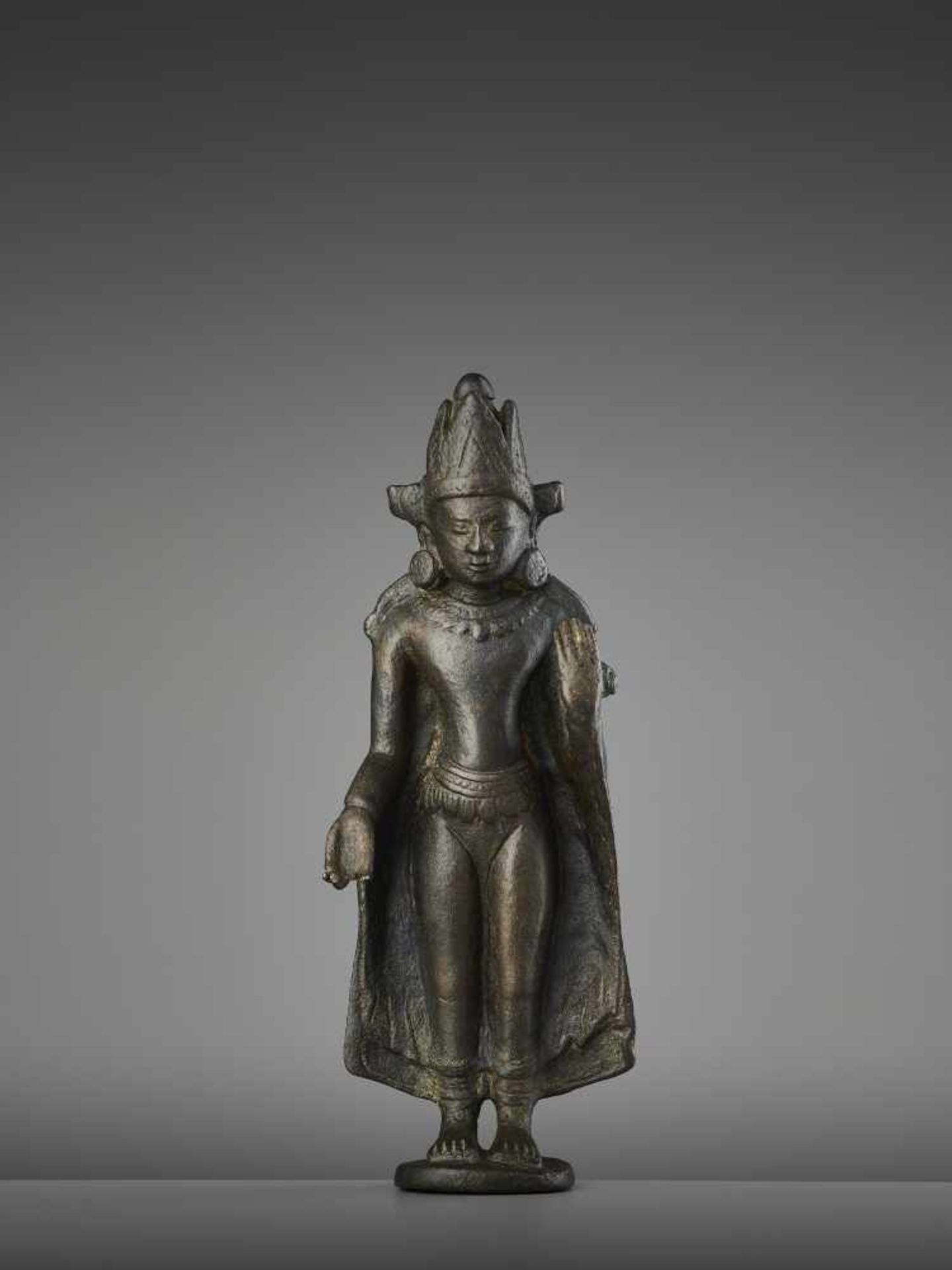 A KURKIHAR CROWNED BUDDHA BRONZEIndia, Bihar, Pala Period, 11th - 12th century. Heavily cast and