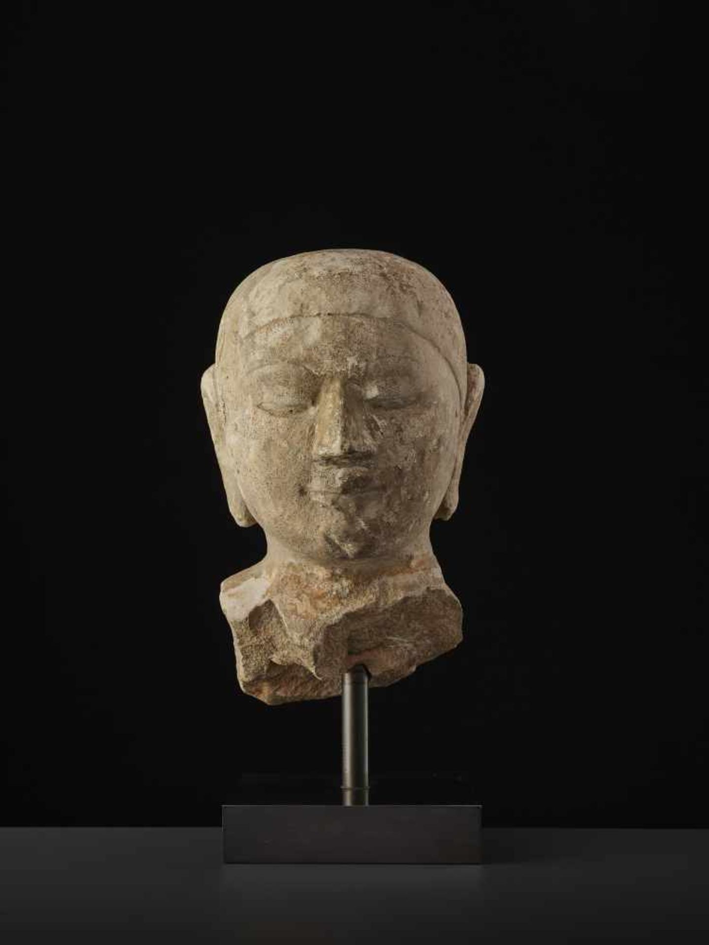 A BURMESE PAGAN SANDSTONE BUSTMyanmar, 13th - 14th century. A large and finely carved bust of a